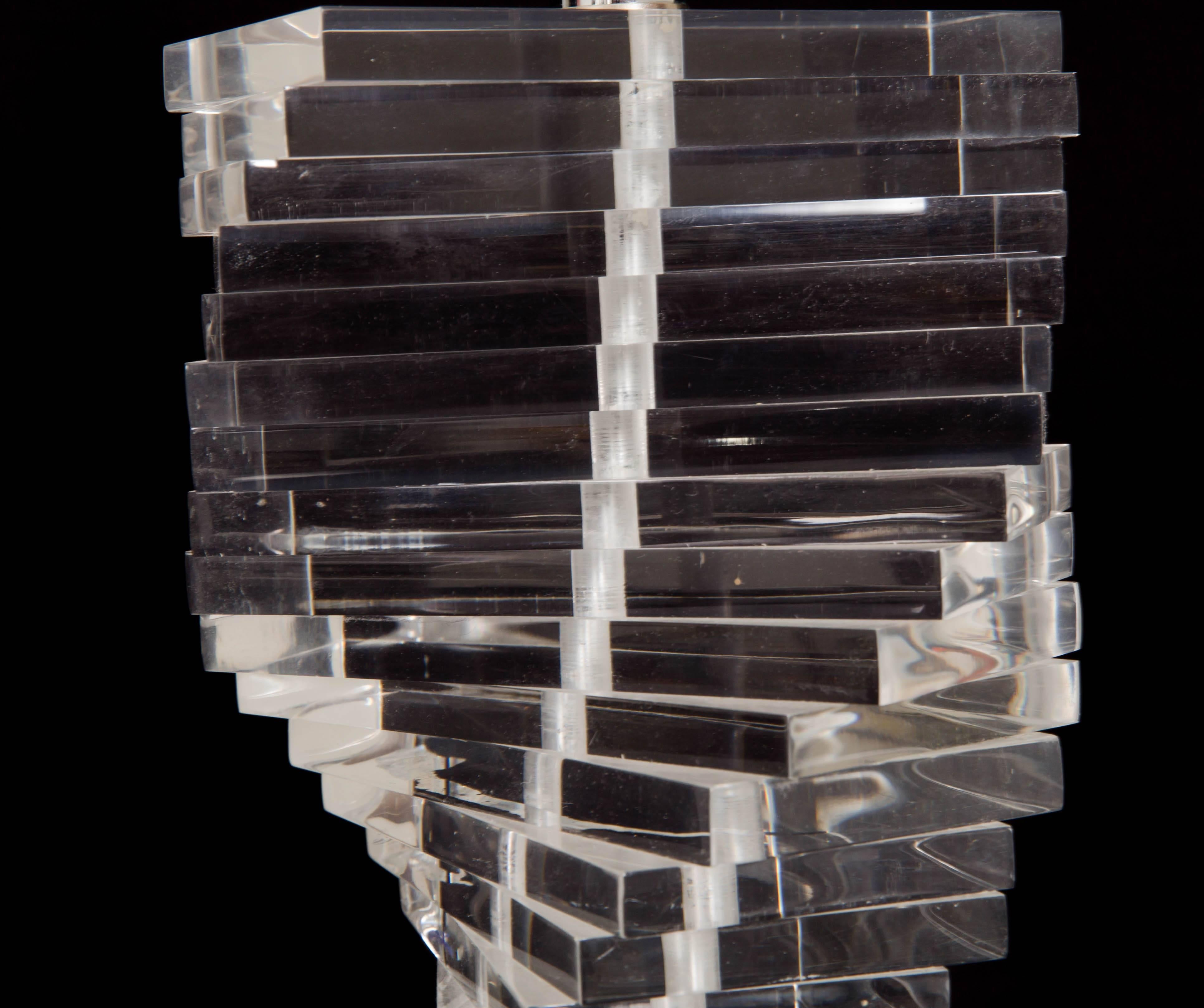 Stacked Lucite blocks twisted to give the helix look of a cascading spiral, Lucite final, no shade.