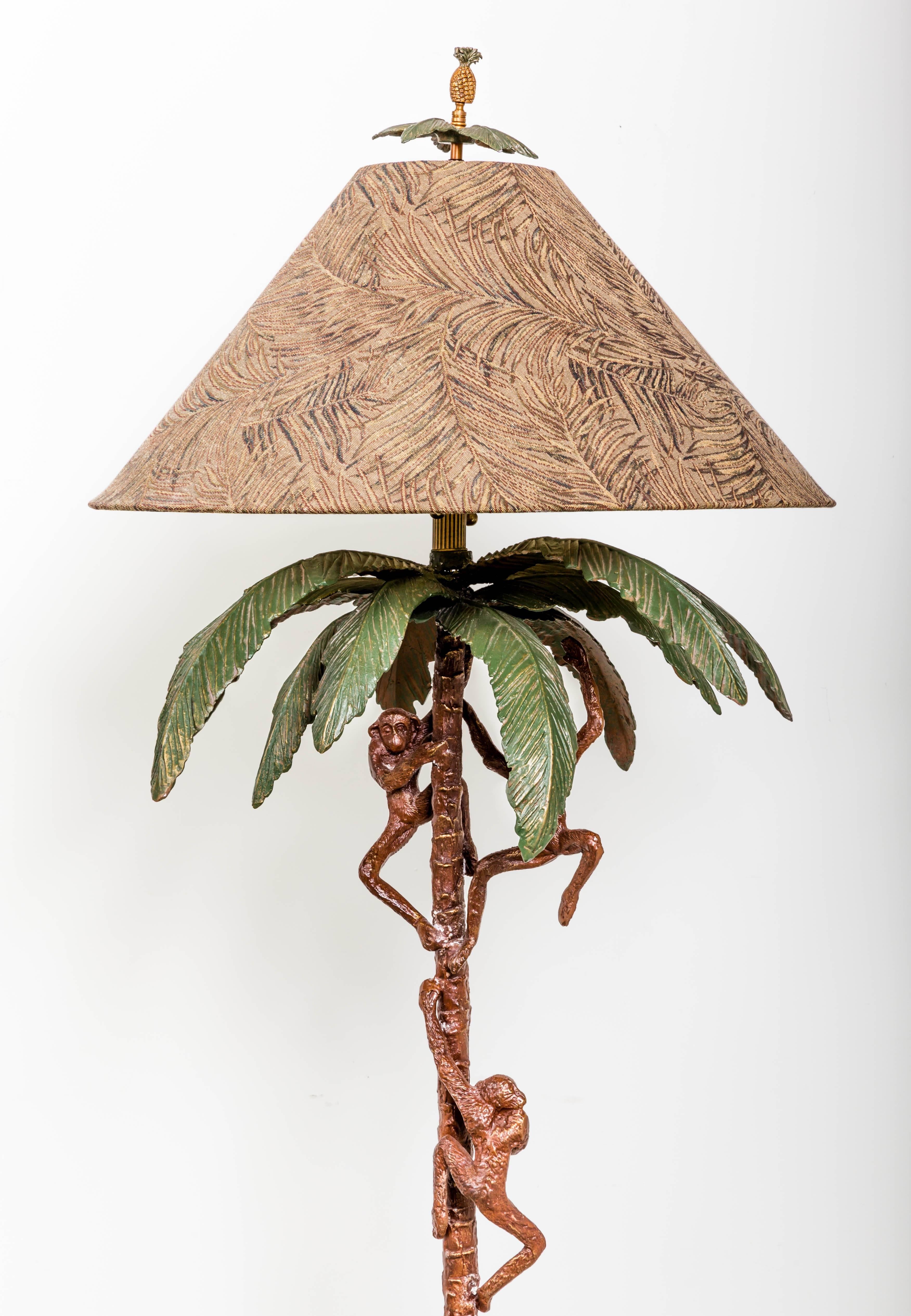 Cast metal floor lamp with monkey's and palm tree. Original fabric lamp shade, pineapple finial. Beach palm chic.