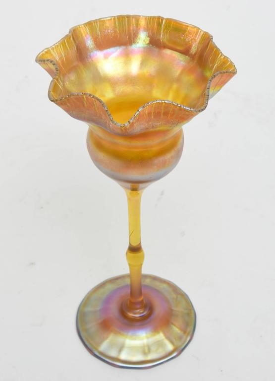 Stunning gold iridescent favorite Floriform vase by Tiffany Studios.
Louis C. Tiffany produced blown glass, named 