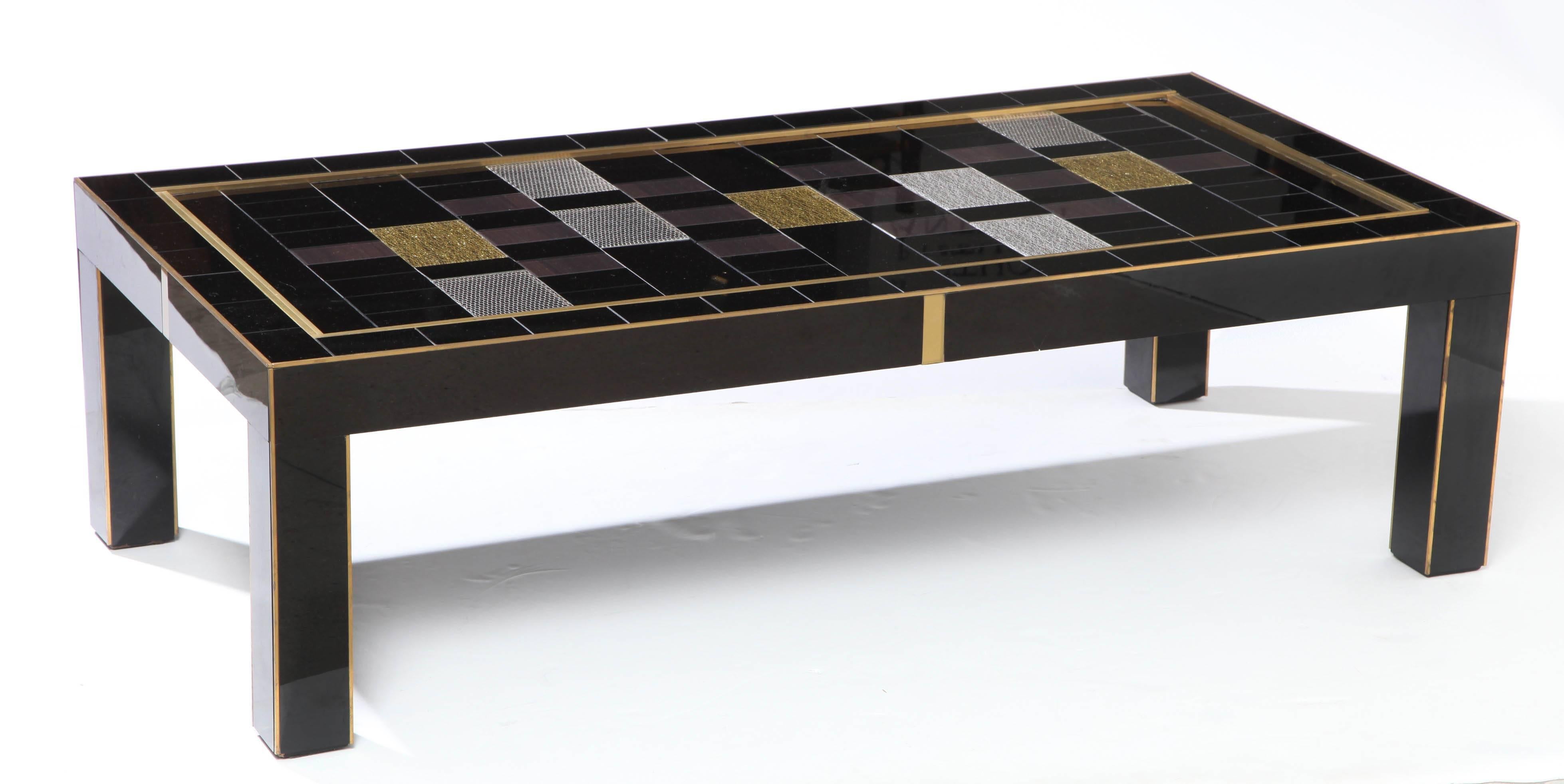 One of a kind, hand-crafted black, silver and gold tinted glass coffee or cocktail table with brass inlays handmade in Italy by a master artisan and artist. Wooden frame is veneered in a black, reverse tinted art glass with geometrically placed