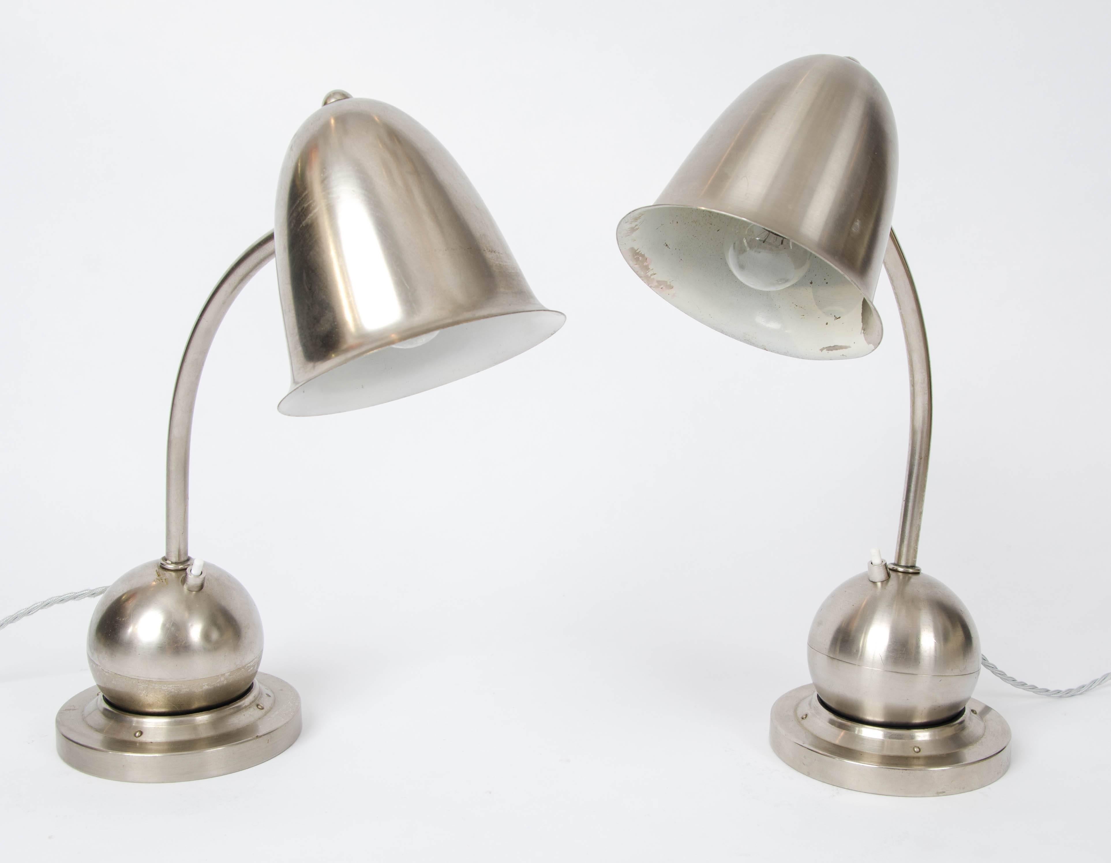 Art Deco table or desk lamps by Daalderop, Giso
Holland, 1930s. Nickel-plated lamps are fully adjustable in position; the ball is weighted and sits on a ring.