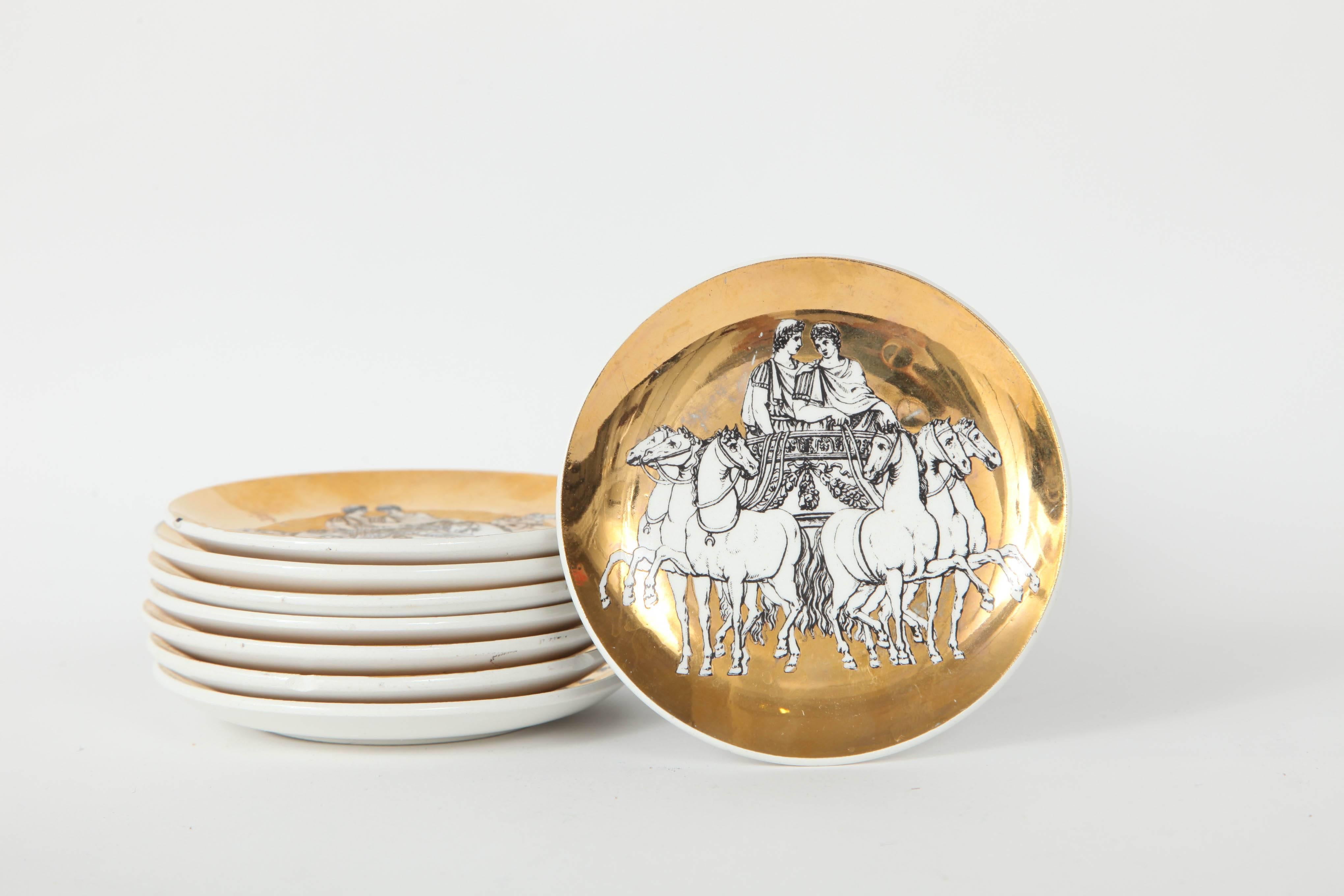 Fantastic set of eight porcelain coasters/nut dishes with a gilded porcelain finish and featuring chariot riders.