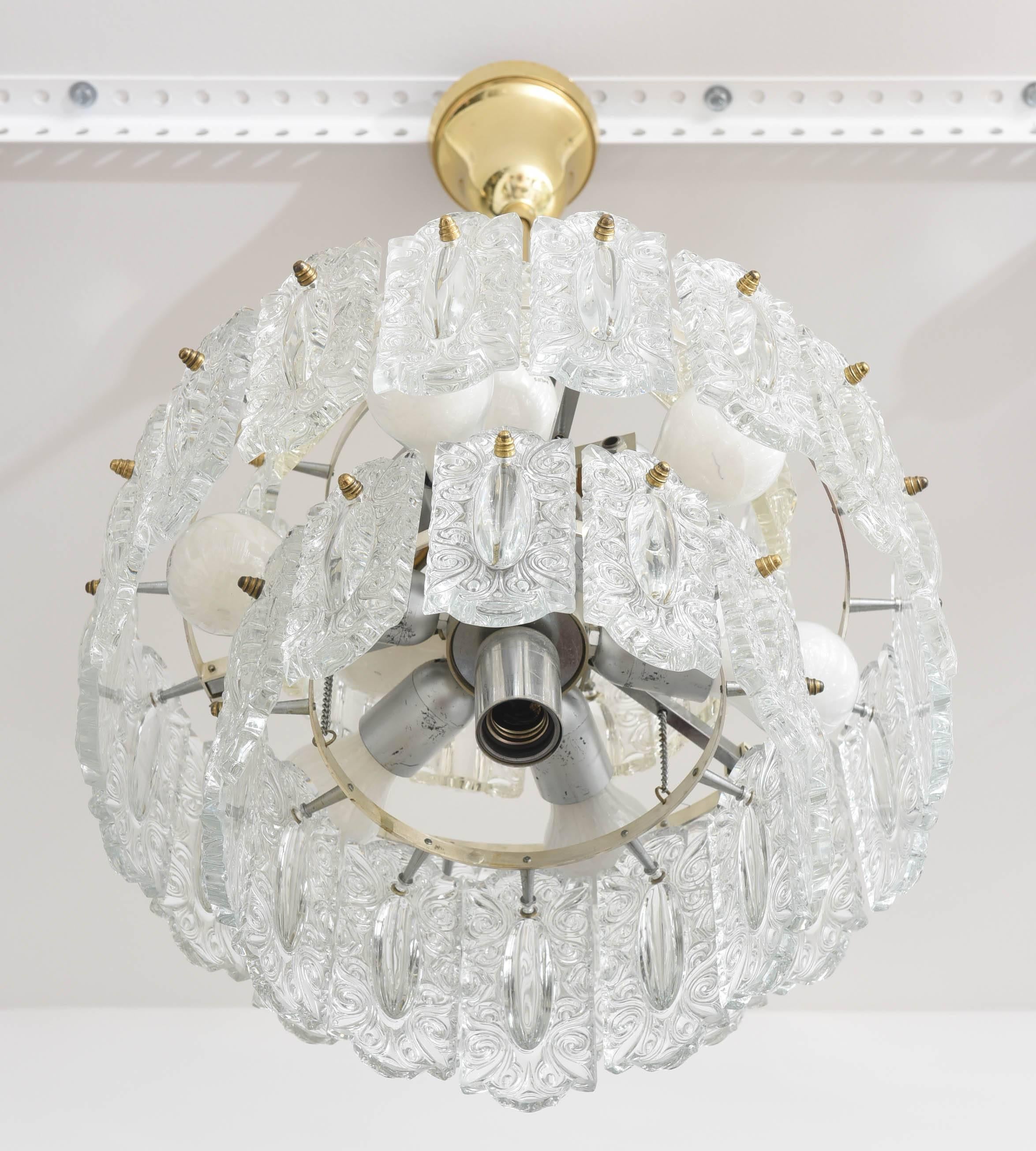 Hollywood Regency style glass floral panel chandelier, Germany, circa 1960s.

Note: This piece takes ten Edison based bulbs.

Please feel free to contact us for the best price, a shipping quote and any additional information by clicking