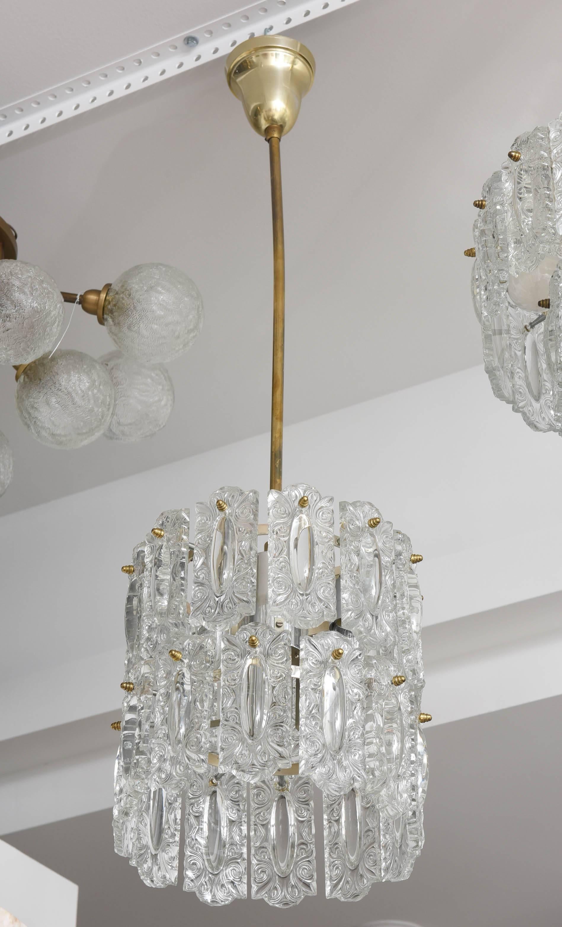 This Hollywood Regency style glass floral panel chandelier was made in the 1960s in Germany. 

Note: This piece takes four Edison based bulbs.

Please feel free to contact us for the best price, a shipping quote and any additional information by