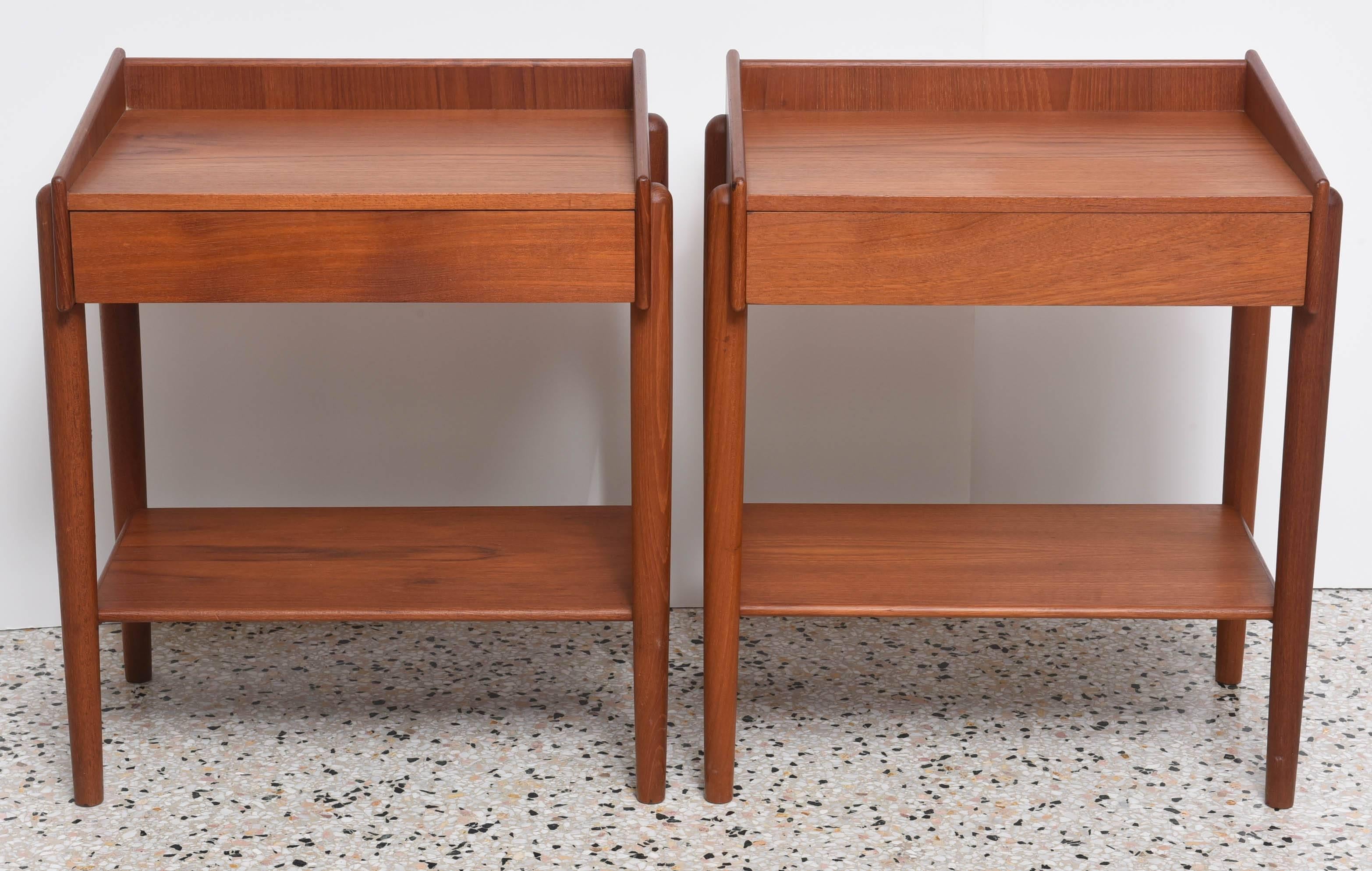 This pair of clean-lined teak bedside tables with a single flush-drawer were created in the 1960s by the iconic furniture designer Borge Mogensen for Soberg Moblefabrik.  

They are the ideal size for bedside tables in a small bedroom or as