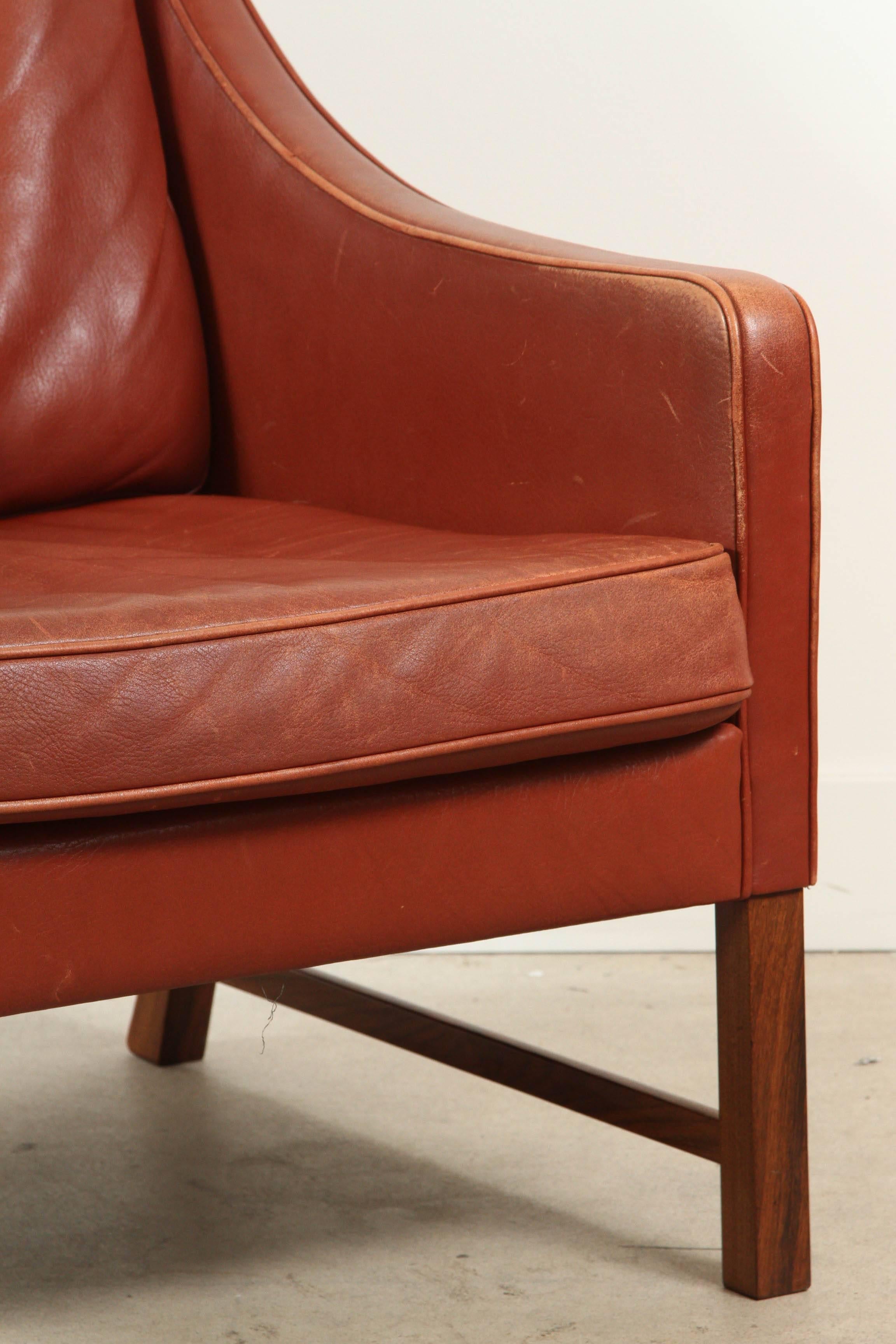 Danish leather club chair with rosewood base by Frederik Kayser for Vatne Møbler.
