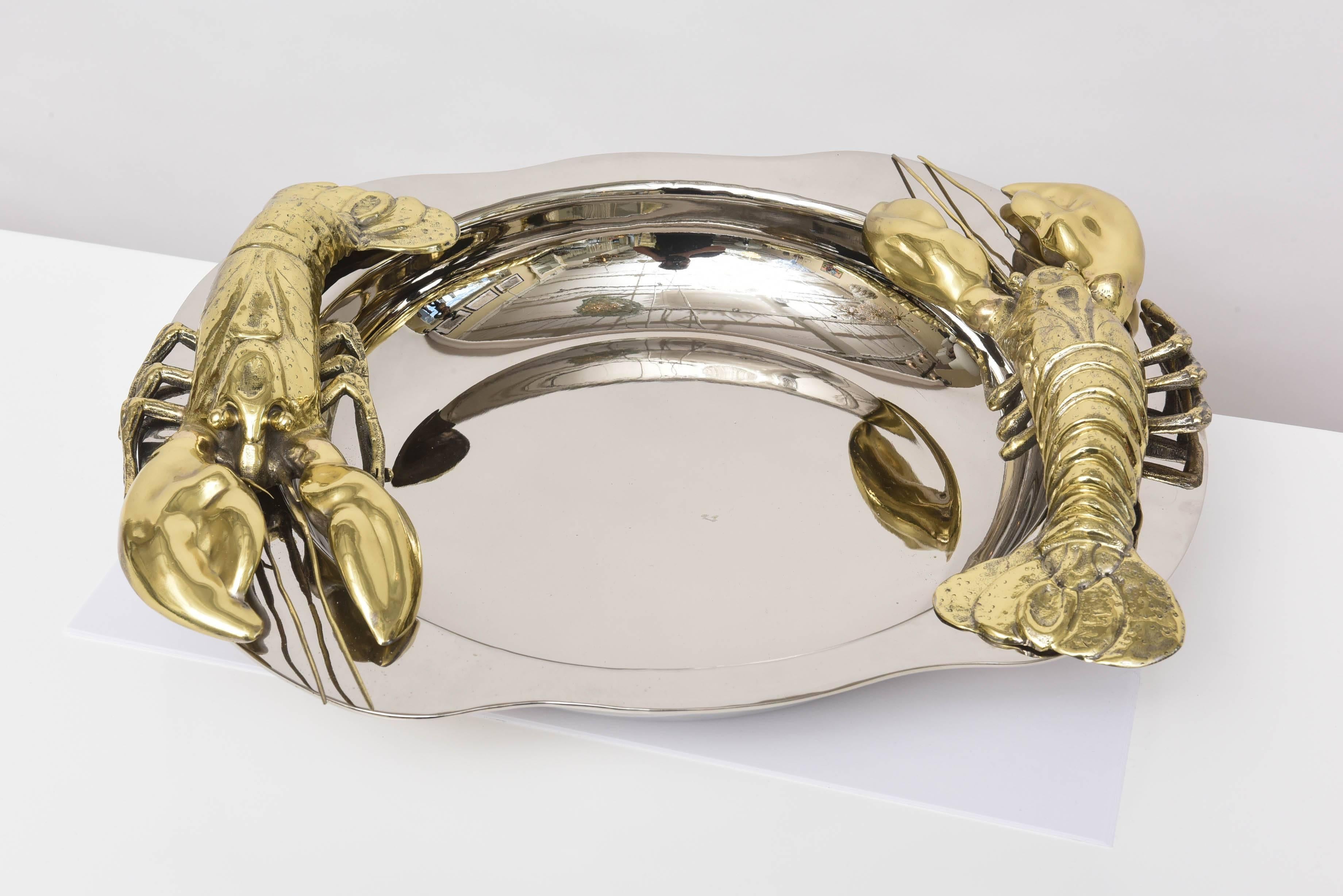 Lobster server created by Franco Lagini from Italy. Silver plated dish with two detailed lobsters in brass on the sides.