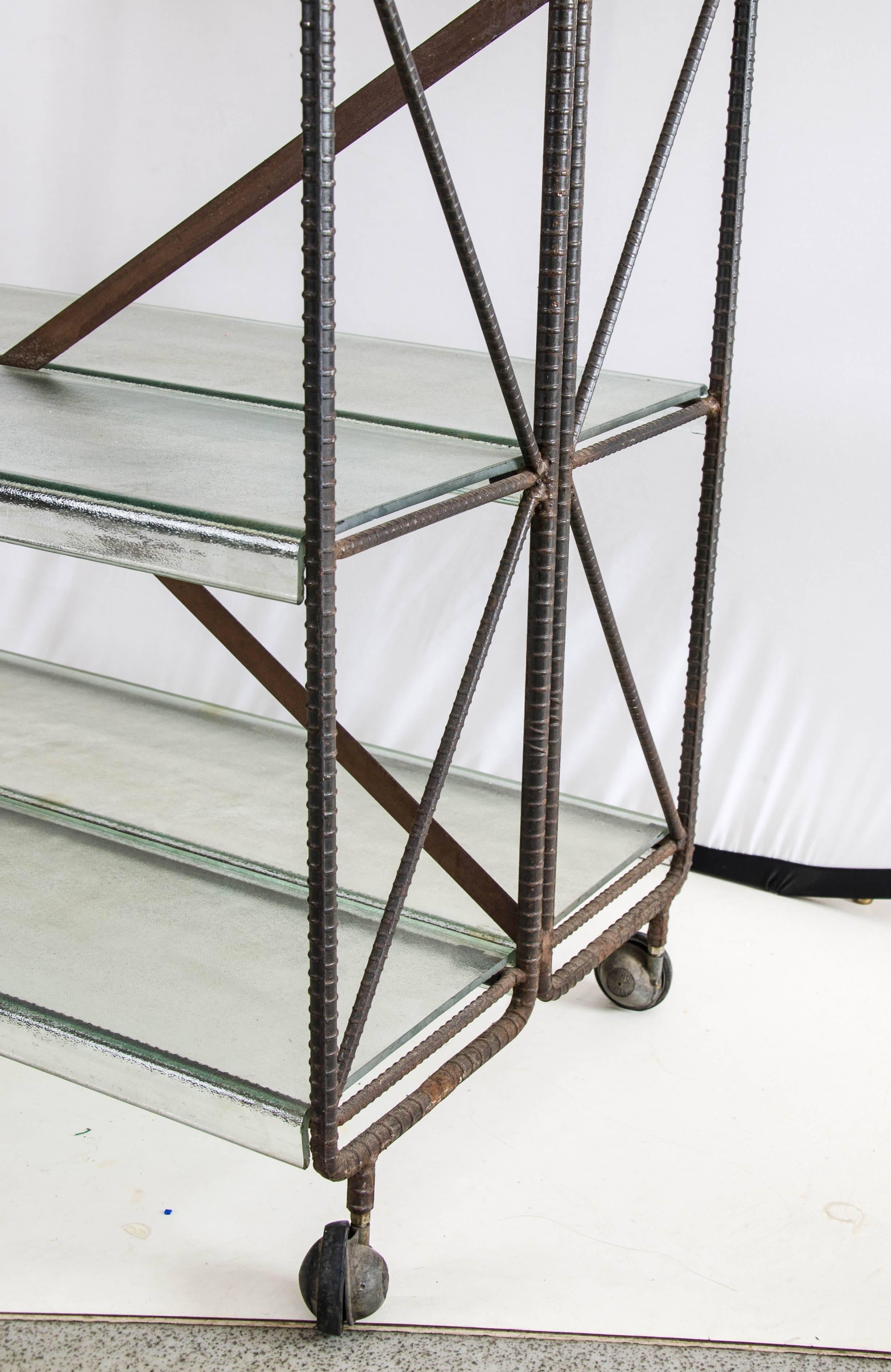 A pair of 'Brutalist' trolleys from the Fogola di Torino bookshop in Turin by Ferdinando Fagnola and Gianni Francione. Attractive molded glass shelves
with industrial bent metallic structure, 1970s.
