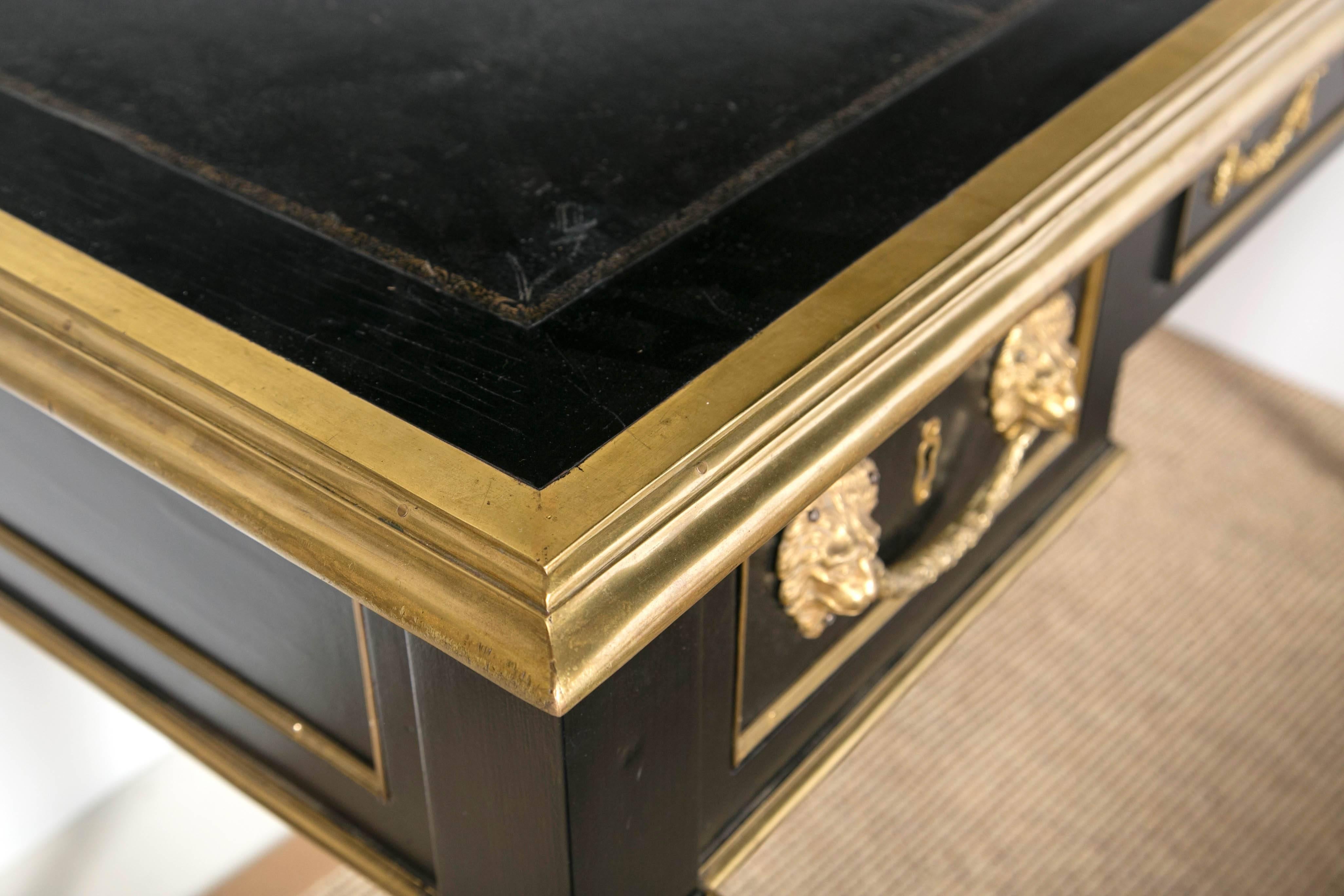 Louis XV style ebony desk with bronze mounts, and black leather top. 