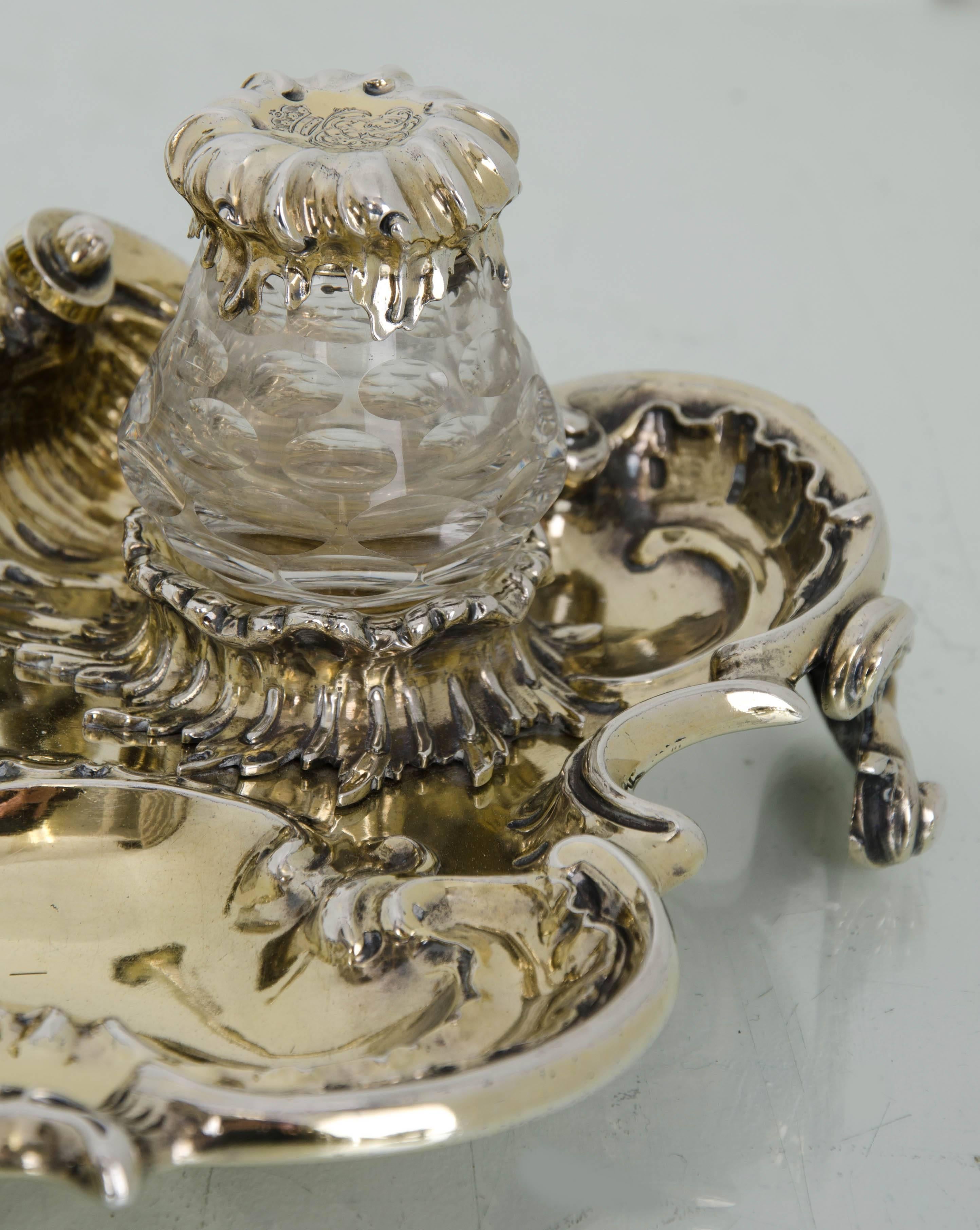 Victorian Antique Silver Gilt 19th Century Desk Inkstand London 1839 Charles Fox

A truly magnificent and exceptionally large, silver gilt, naturalistic desk inkstand.  The inkstand is in a shell form with hand chased, naturalistic decoration