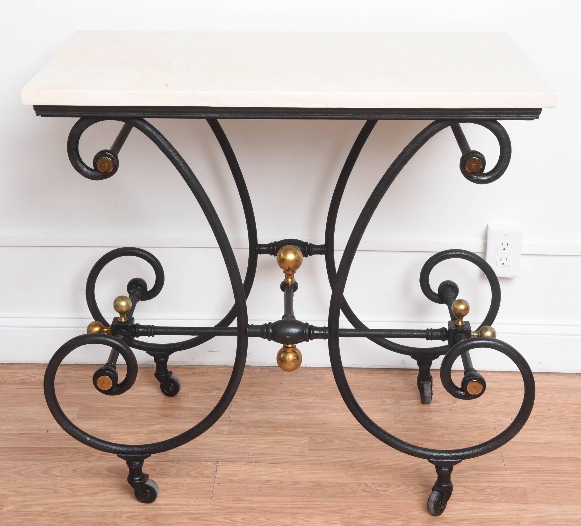 19th century French Bakers table, iron and brass with marble top. Paint black on casters.