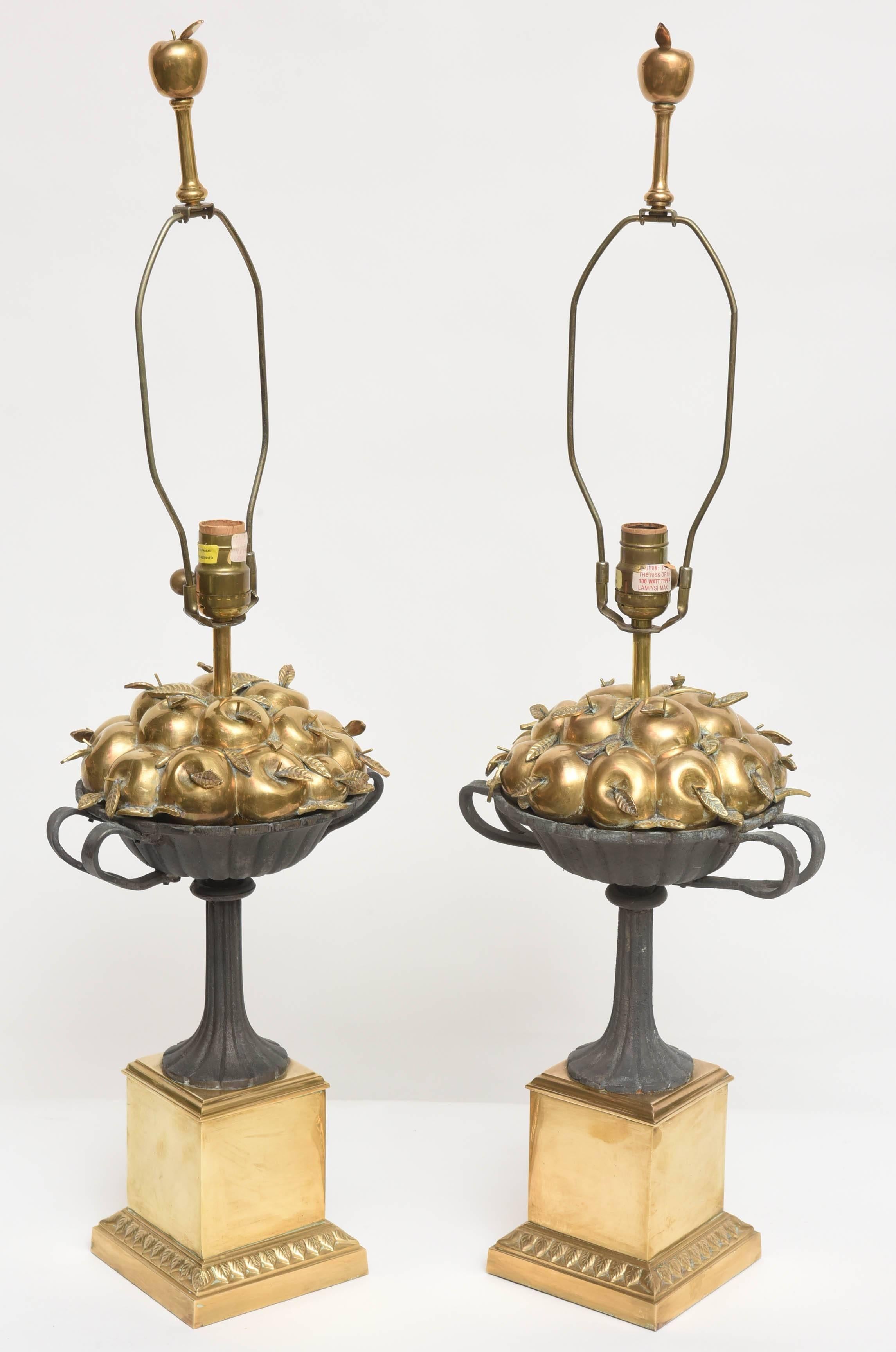 Wonderful and whimsical pair of brass lamps with brass apples in an iron handled basket. Brass base and brass apple finials. Sold with out shades. By Chapman.