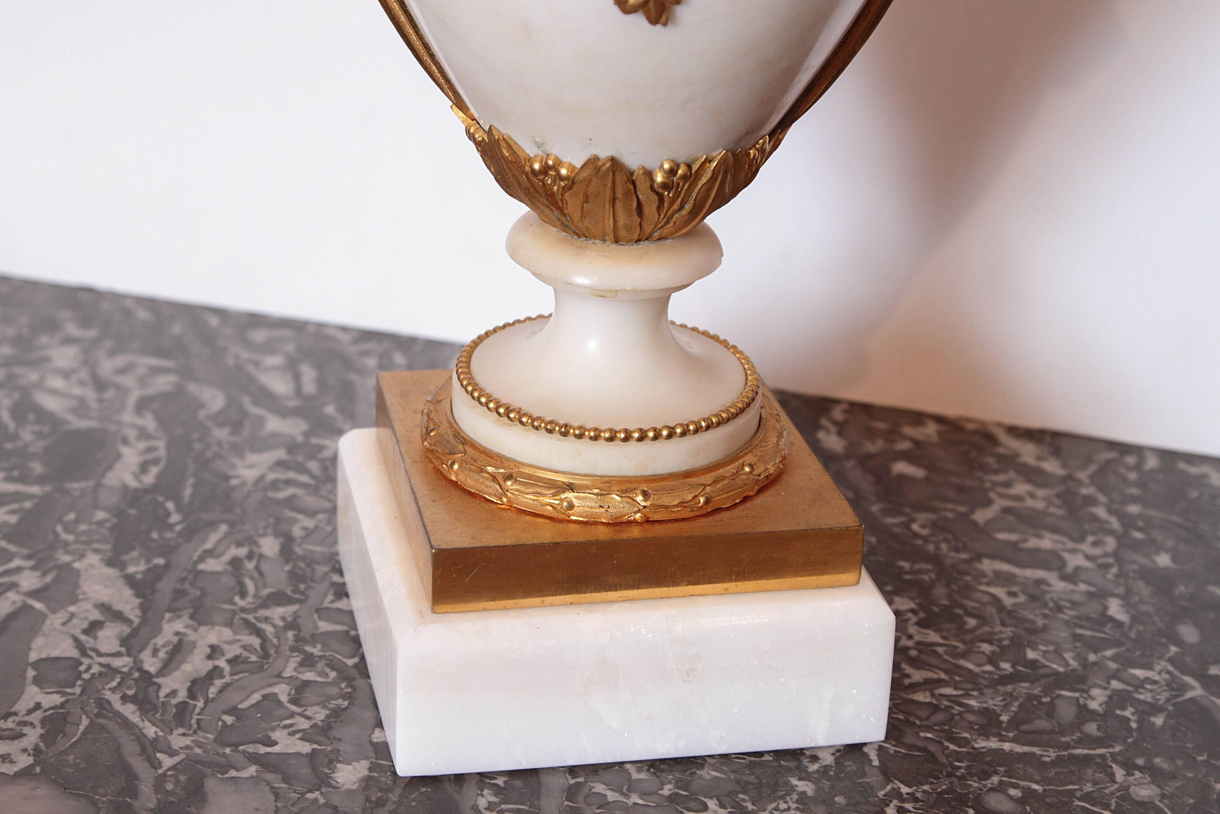 Pair of 19th Century French Carrera Marble and Gilt Bronze Urns 1