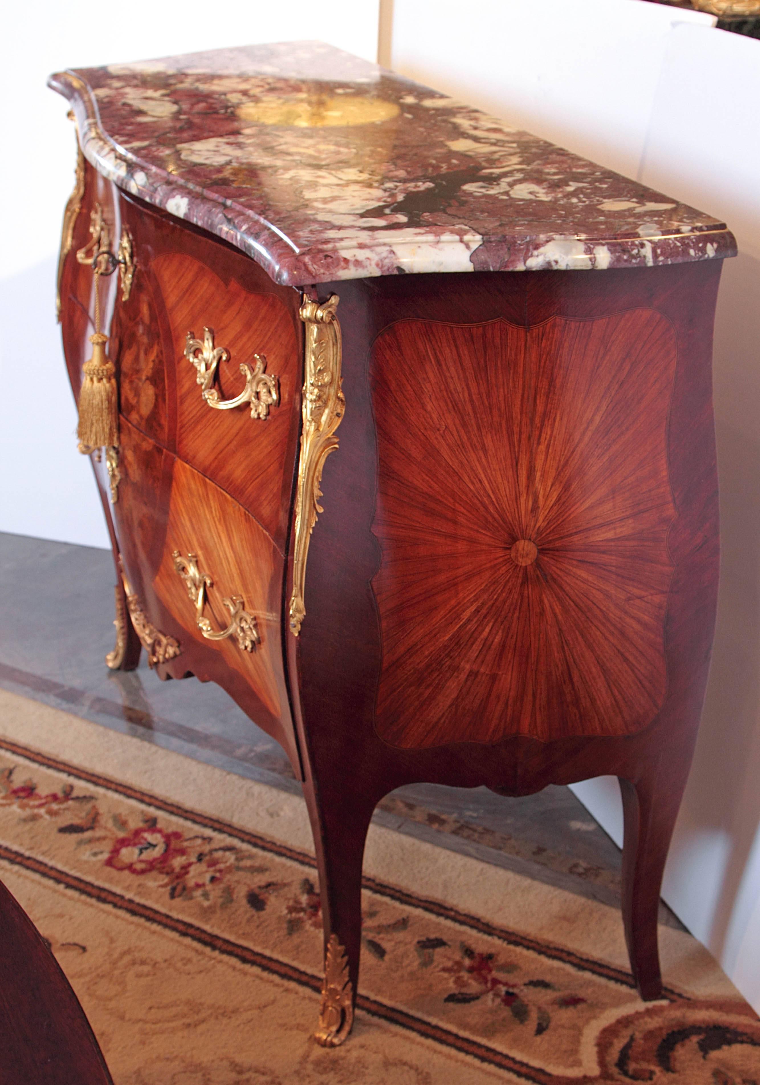 Pair of Beautiful 19th c  French Louis XV mahogany and kingwood marble top commodes with satinwood inlay and marquetry design. Gilt bronze mounts 

