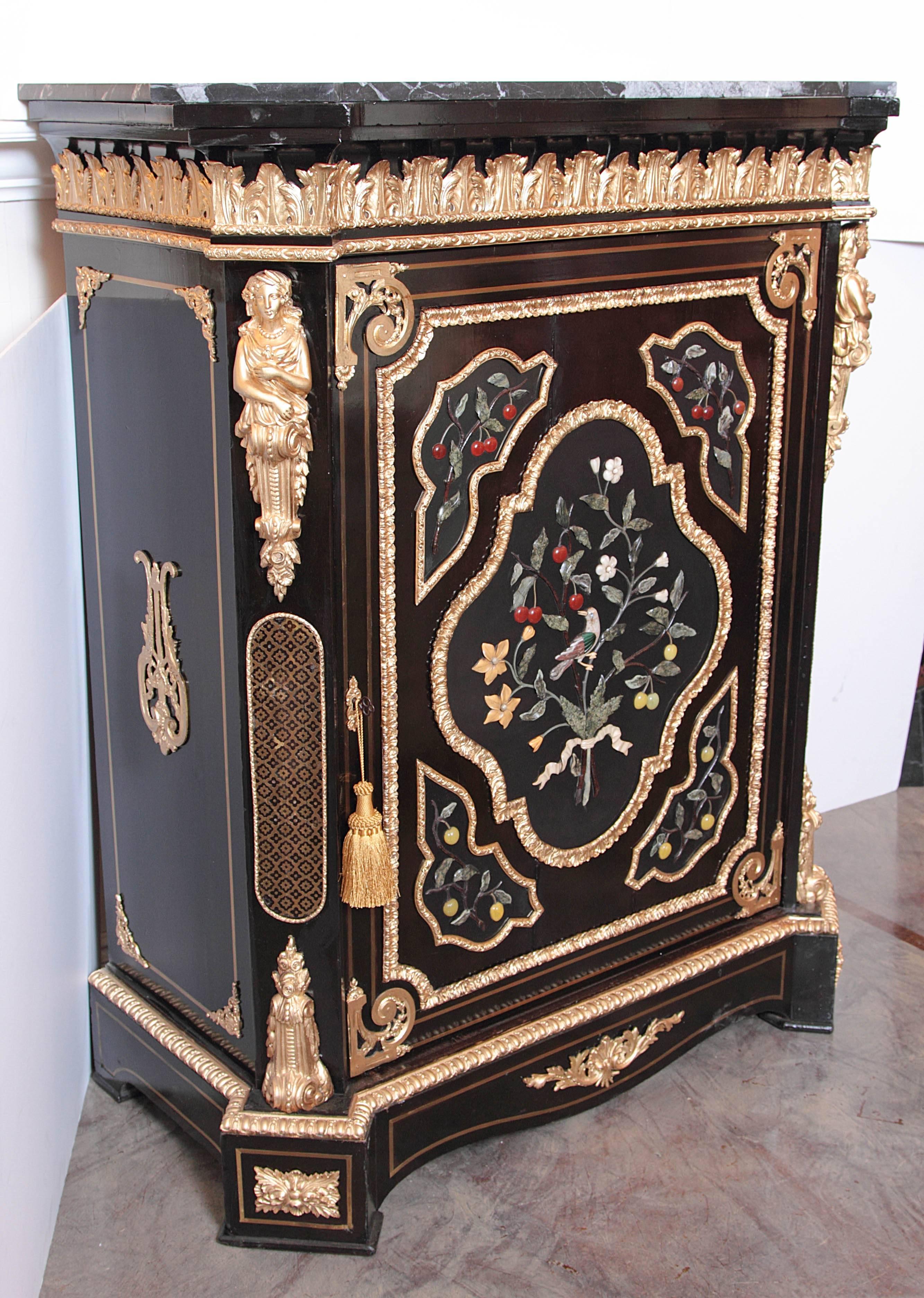 Pair of 19th c French ebonized and pietra dura inlayed cabinets with gilt bronze mounts . marble tops signed Belfort Jeune . pictured in European furniture book by Christopher Payne page 144 