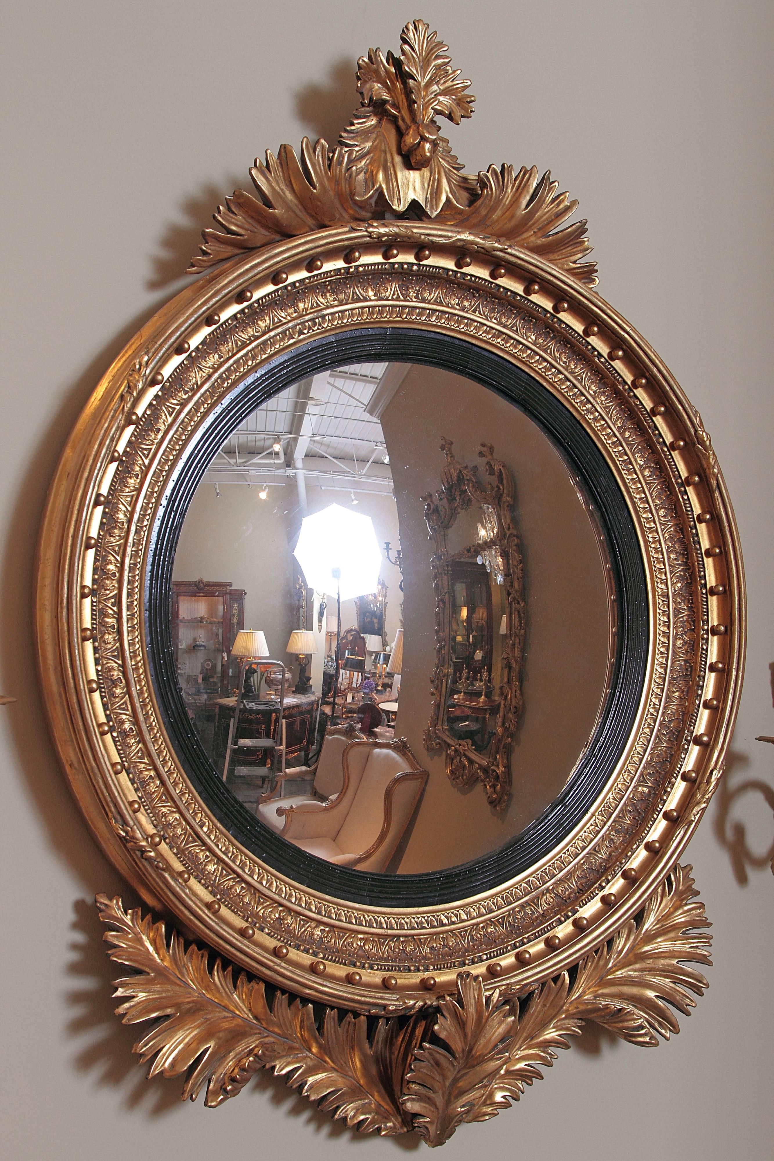 19th c Regency hand carved gilt convex mirror, unusual leaf design