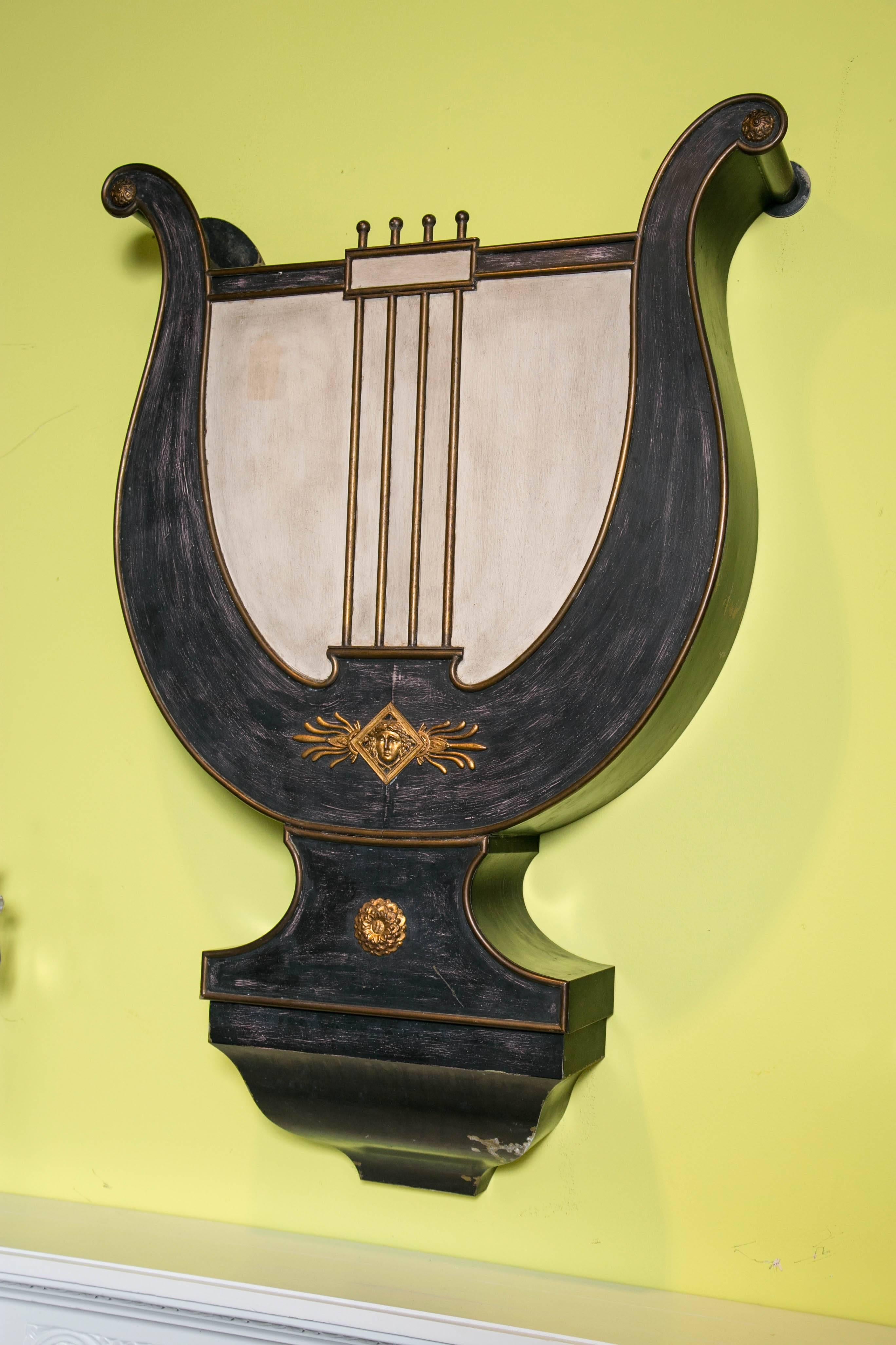 Lyre wall hung planter tole and iron nicely painted with gilt details.