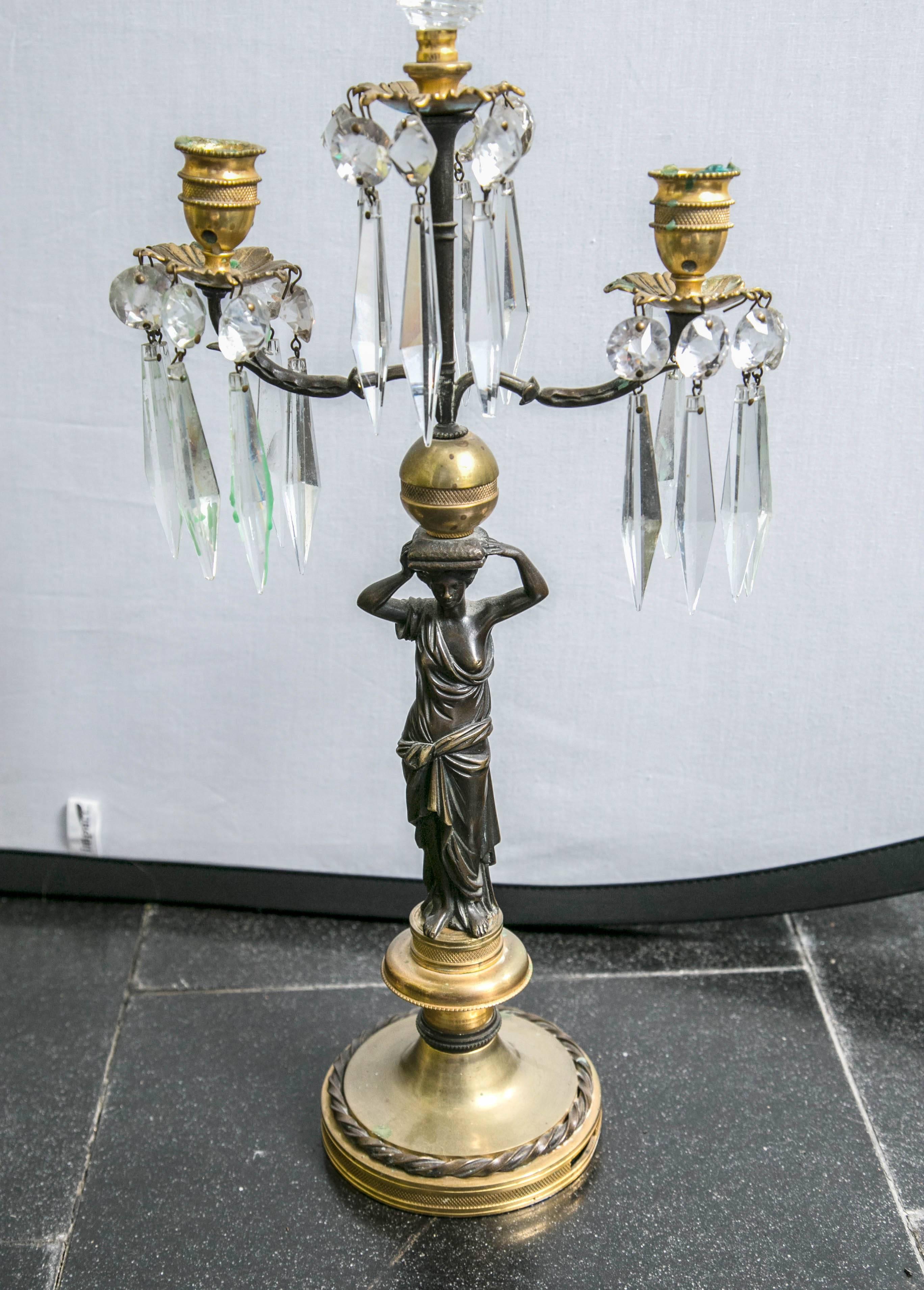 Lovely pair of three light candlesticks in gilt bronze with crystal drops.