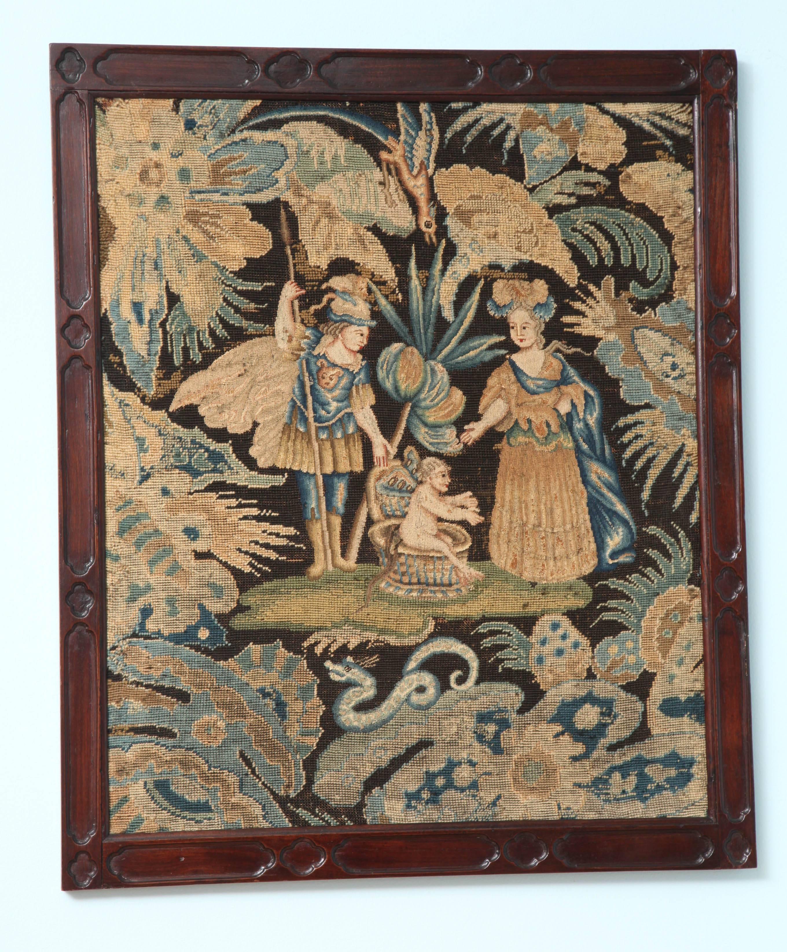 A pair of George II needlework panels within hand-carved mahogany frames; the panel on the left with Chinese figures, the woman with a small bird perched atop her hand; a leaping spotted dog amidst foliage and a bird on top; the panel on the right