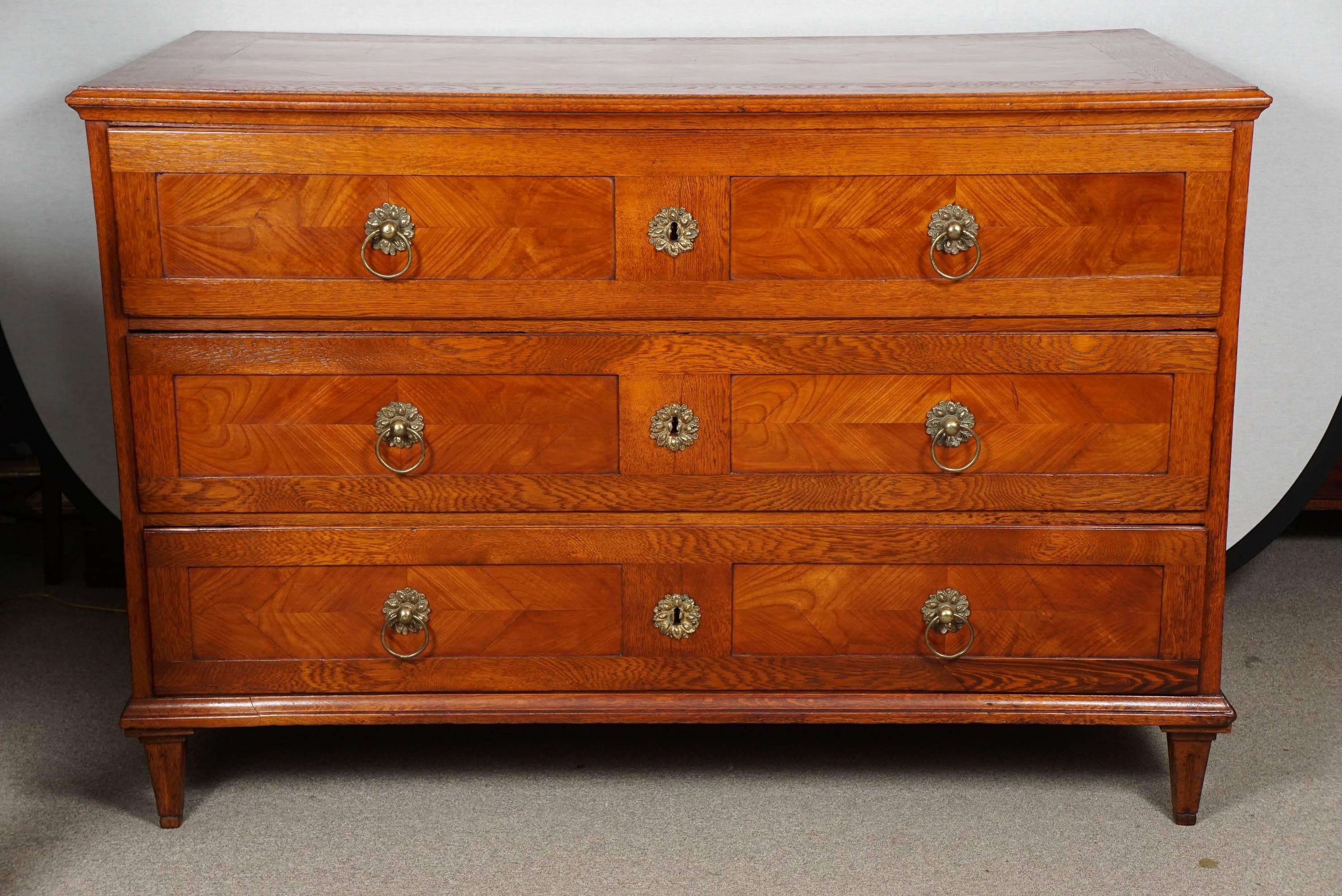 Continental parquetry commode with brass pulls and original locks.