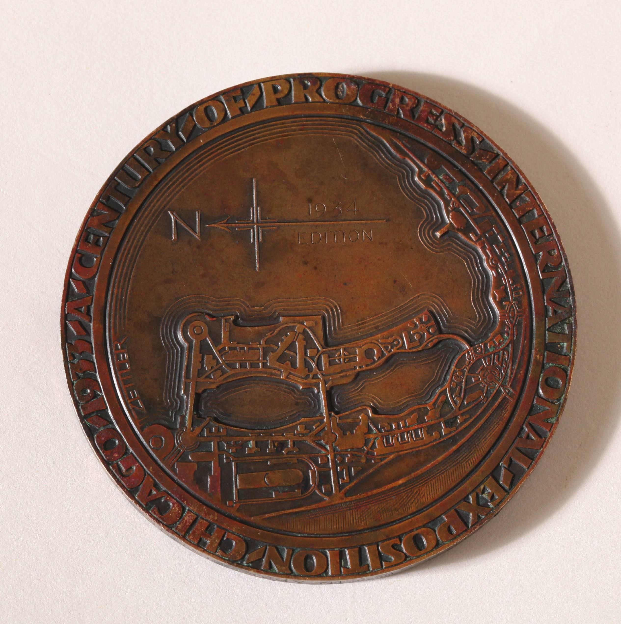 American Art Deco Bronze Medal in High Relief commemorating the Century of Progress International Exposition Chicago

With the symbolism of the  exposition on the obverse and a map of the exposition on the reverse.

Signed ERZ on obverse and