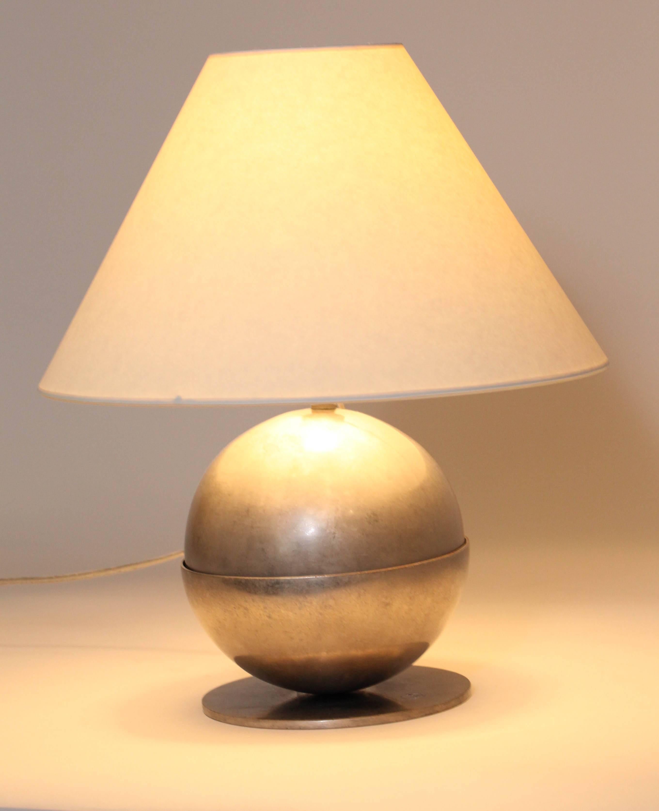 With adjustable nickeled brass sphere in base and on circular foot; with shade.
With original French electrical components, but rewired to American standard. 
Impressed Boris Lacroix cachet. 
Good working condition.

Measures: Base: 5 ¾”