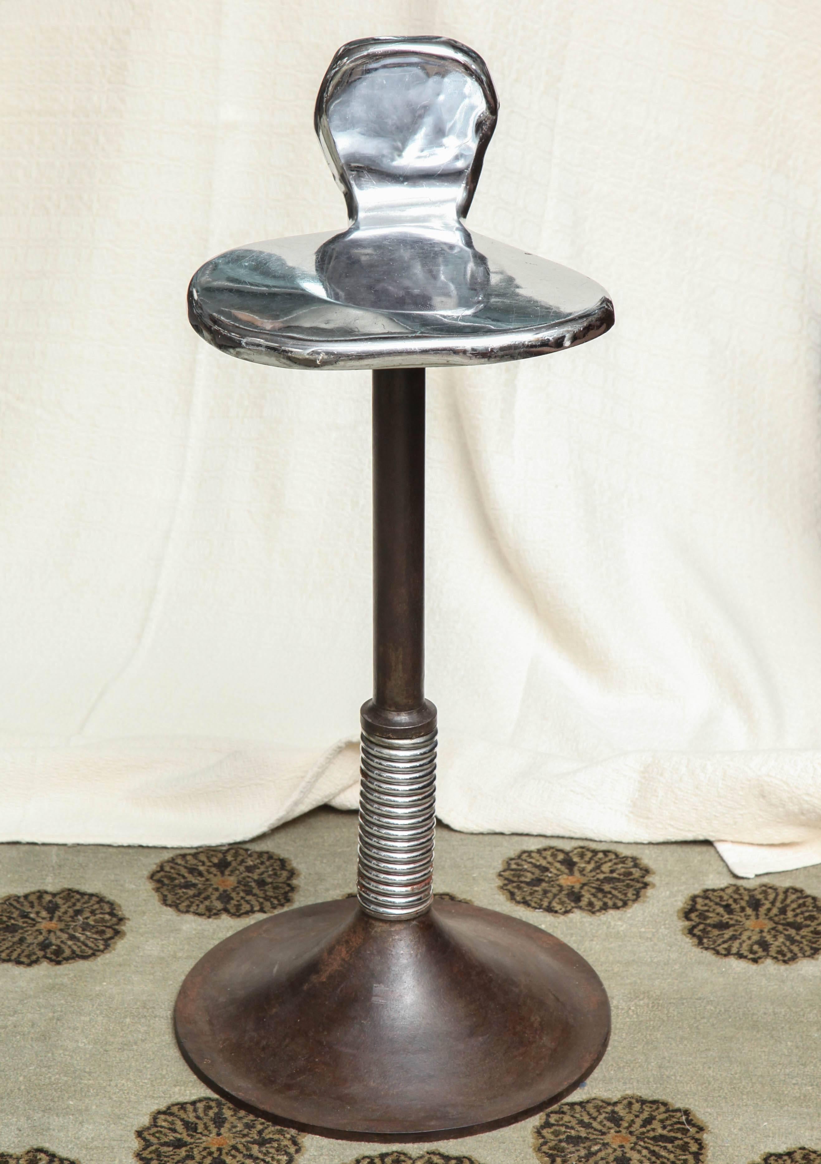 Steel stool with spring and chrome-plated amorphic seat, circa 1940.