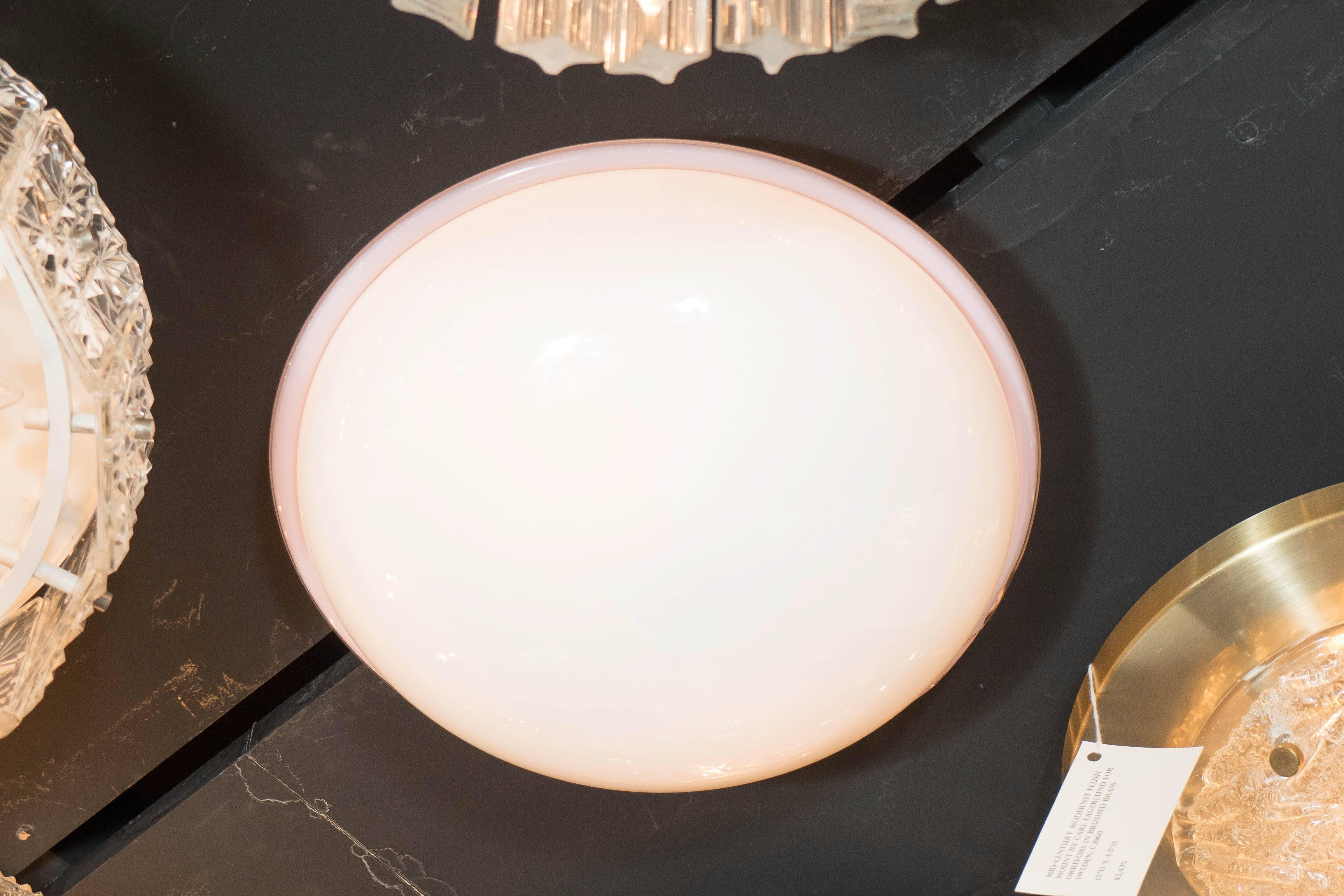 This exceptional flush mount by Barbini features a Murano milk glass dome within the handblown pale mauve glass trim. When lit, the light is diffused evenly throughout the glass giving a soft Ambience. It is newly rewired and is in excellent