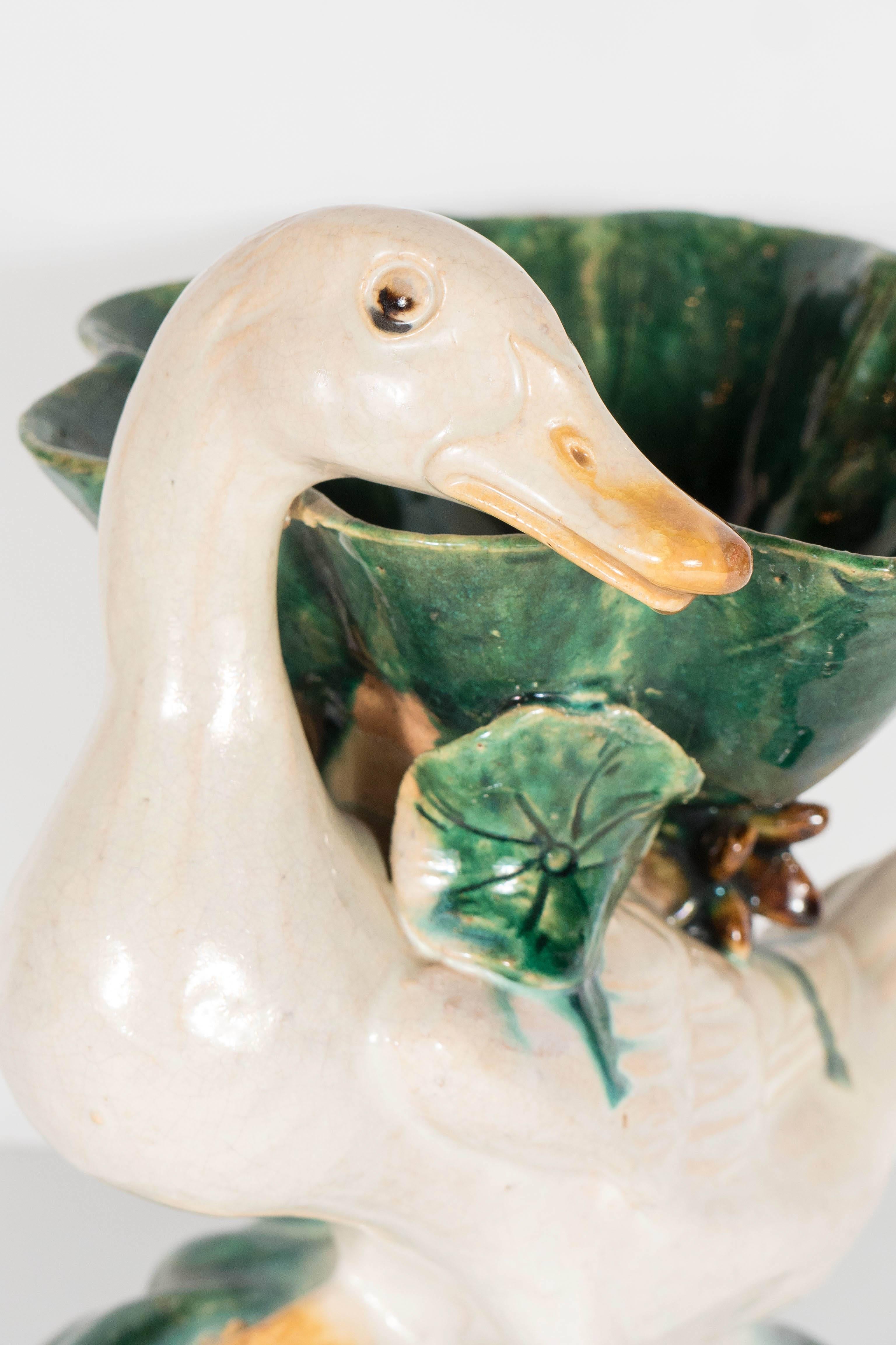 Early 19th century duck form pottery brush washers. They have been hand painted in hues of emerald, taupe, tobacco and ochre. These exquisite pieces would be perfect as decorative objects and could also be used for a variety of functional purposes,
