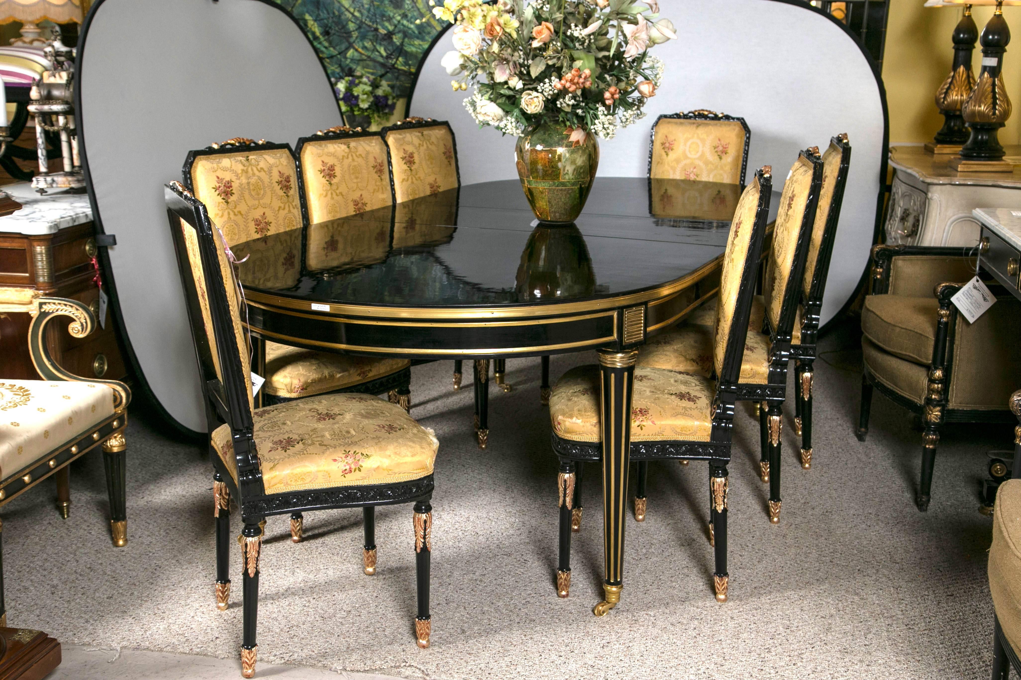 Louis XVI style ebonized dining table by Maison Jansen. A spectacular Louis XVI style dining table by Maison Jansen having three 16" expandable leaves. Wonderfully done in a Steinway black lacquered ebonized finish. The solid bronze sabots on