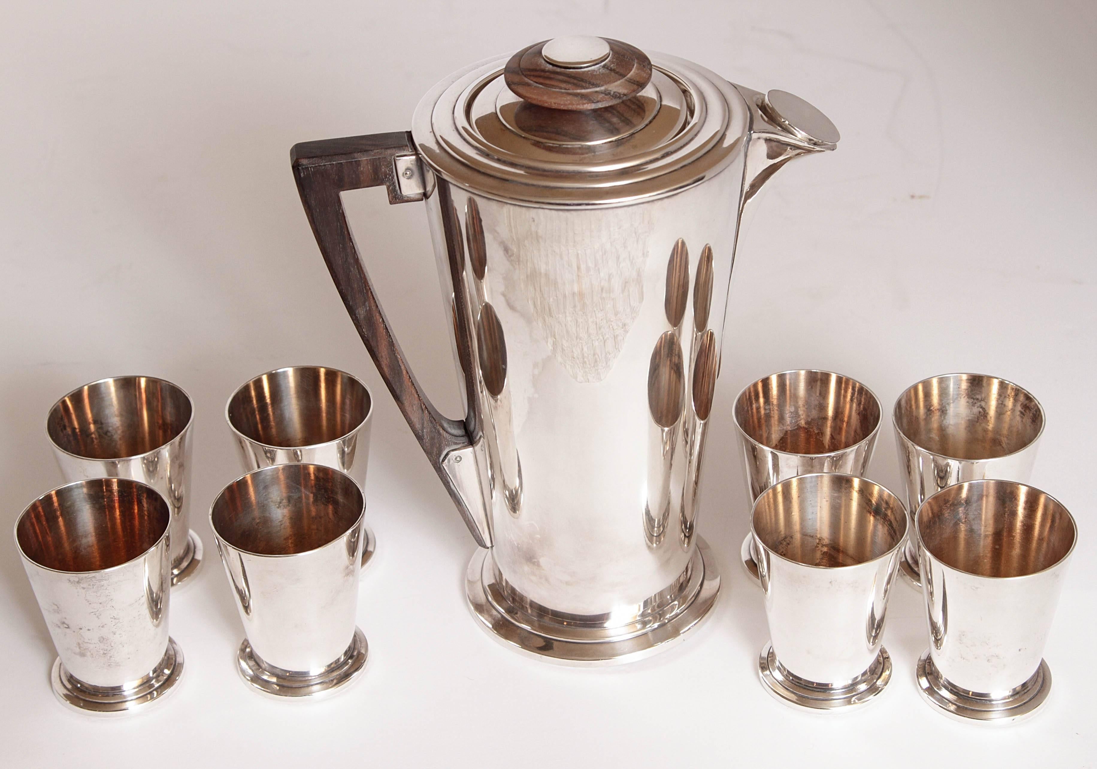 Primo quality thick silver plate and amboyna / Macassar wood beverage set.
circa 1927 patented design, originally for the Cruise Ship, set #360.
These examples are not marked with the patent date.
Shaker or pitcher with original removable cap,