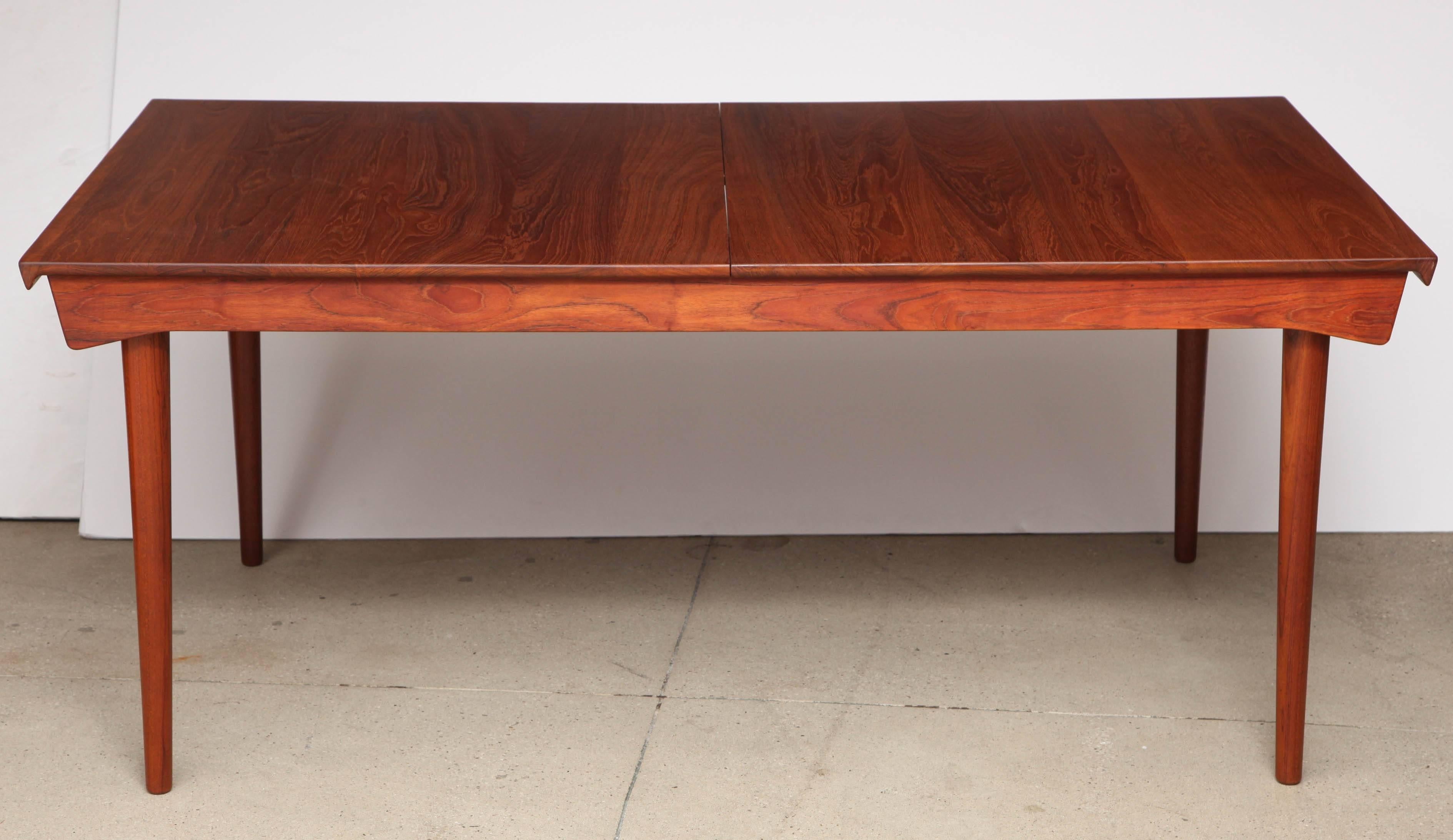 Vintage 1950s Teak Dining Table by Finn Juhl

This Danish Modern dining table designed by Finn Juhl in the mid-1950s. Two 19.5