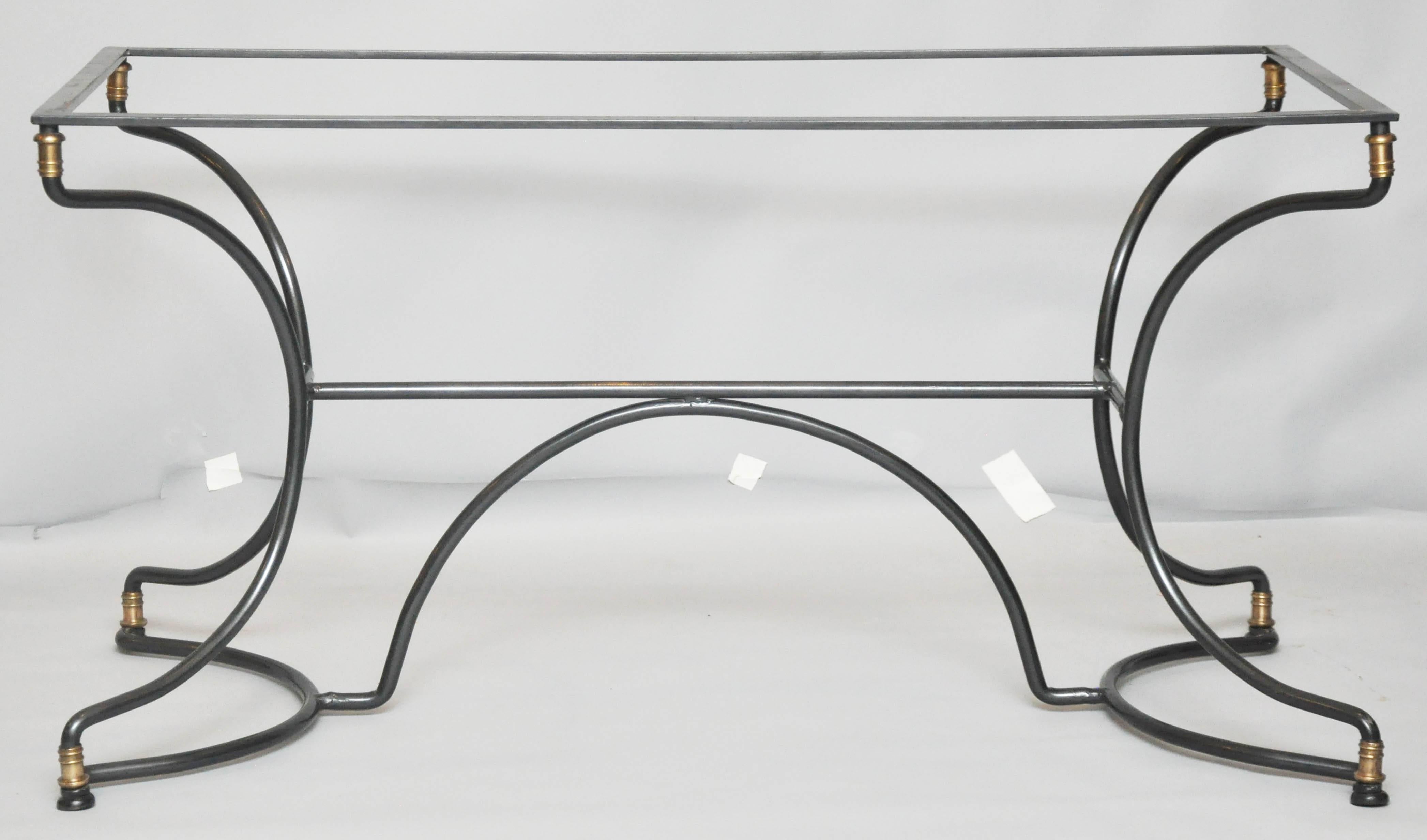 French Art Deco iron cafe table, rectangular form and can use custom sized glass or marble top. Clean geometric shaped base with brass ornaments at crown and foot.

             