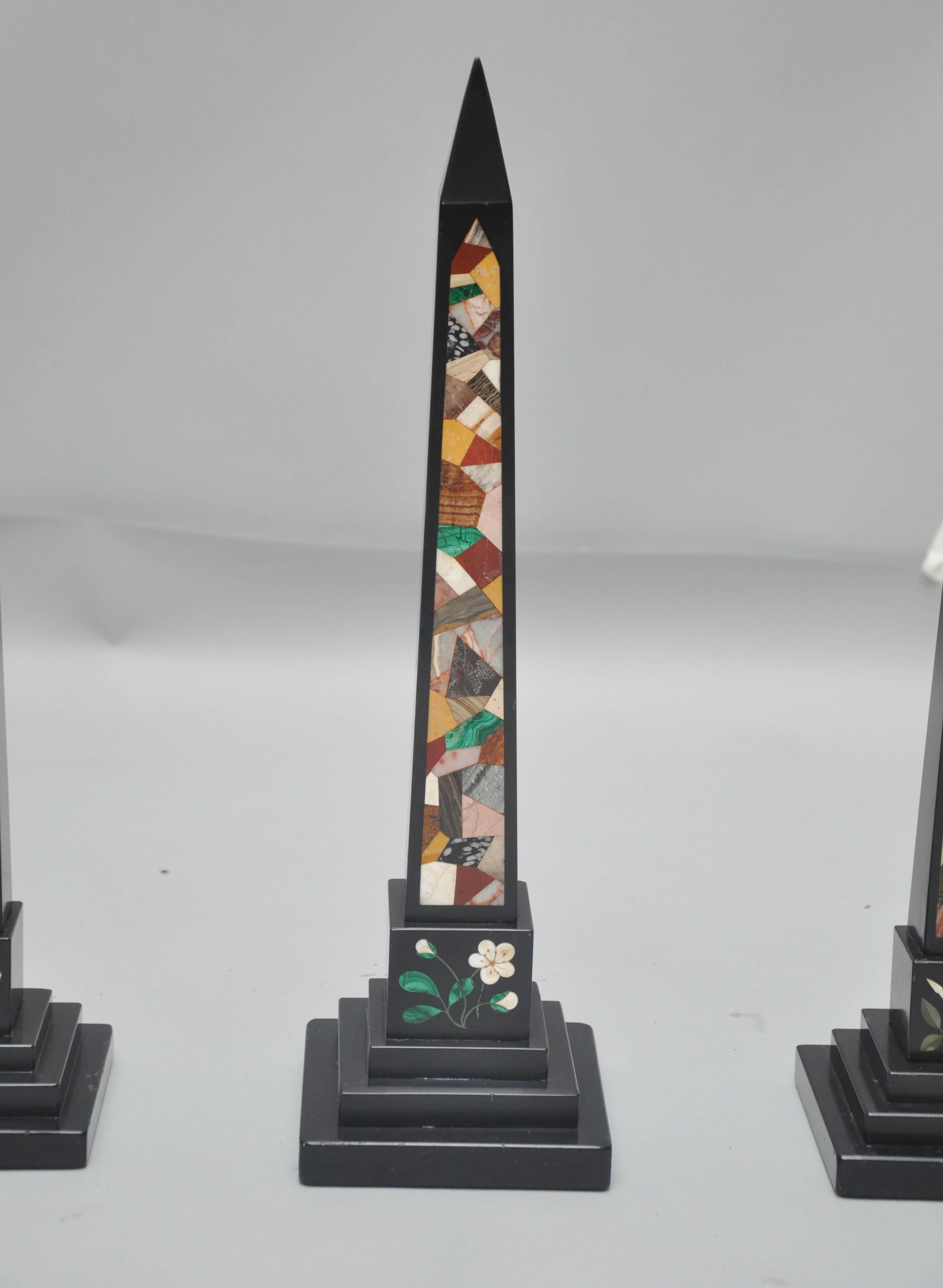 Set of five Derbyshire black marble graduating obelisks, tapering columns with