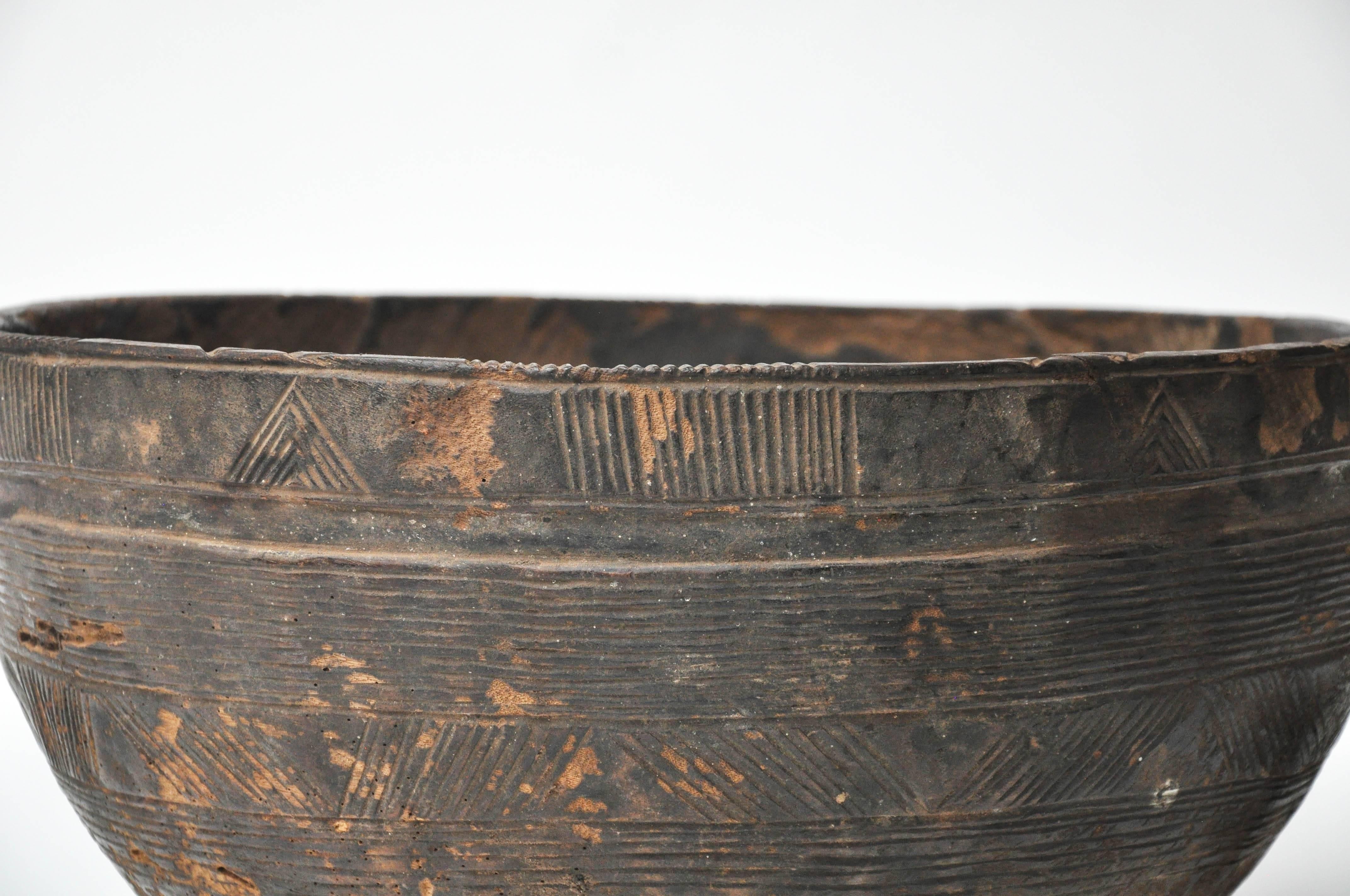 Beautifully hand carved Wood Bowl with inticate detail.