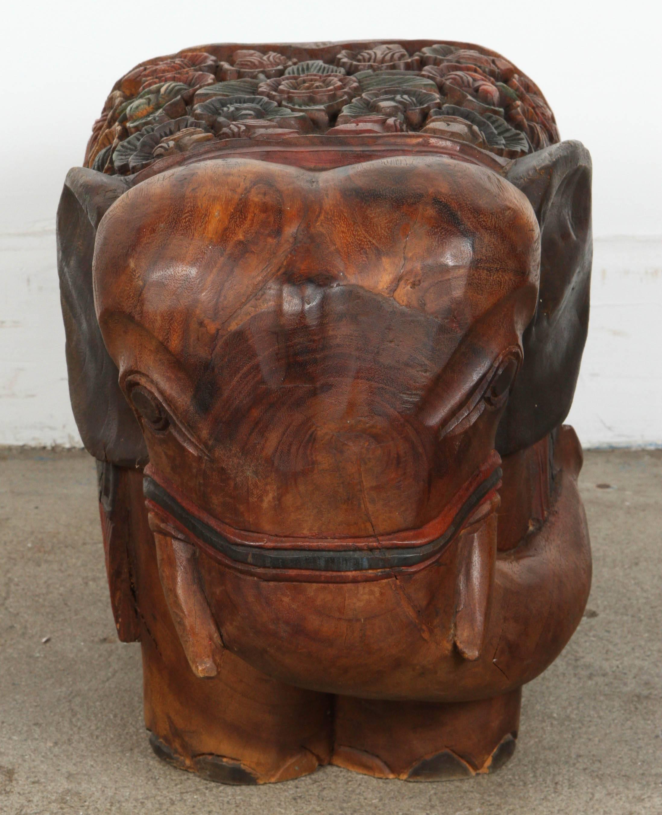 Hand-carved wooden elephant stool, or occasional table.
Very nice hand-made, hand-carved and hand painted on one piece of wood