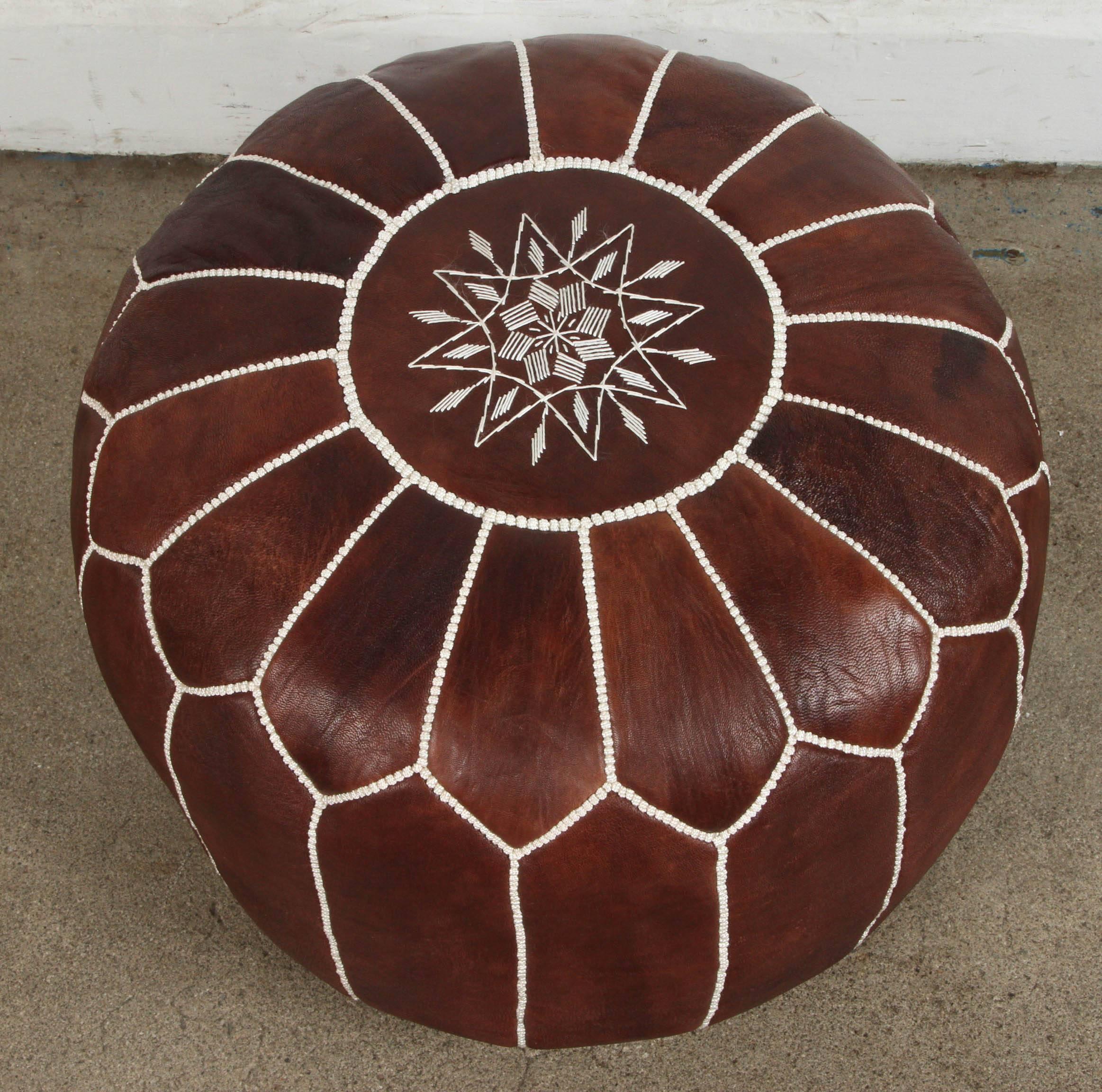 brown leather pouf