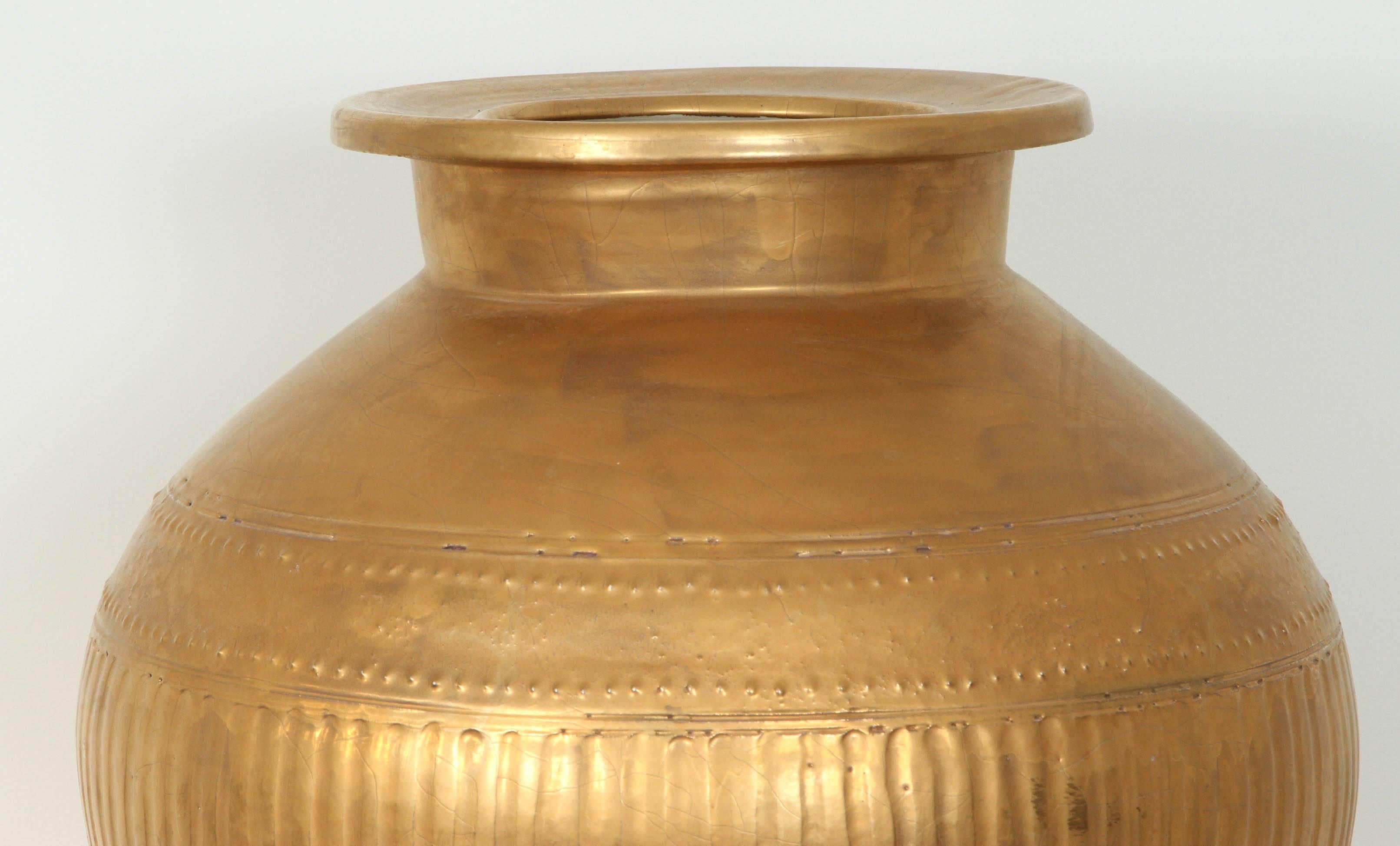 This beautiful and enormous gilded ceramic urn in the form of an antique Amphora.
It came from an Indian Wells estate styled completely by Steve Chase.