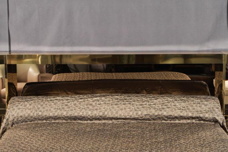 Learn how they can become a dramatic but complementary focal point for your bedroom decor. brass and bronzed mirrored platform bed by ello