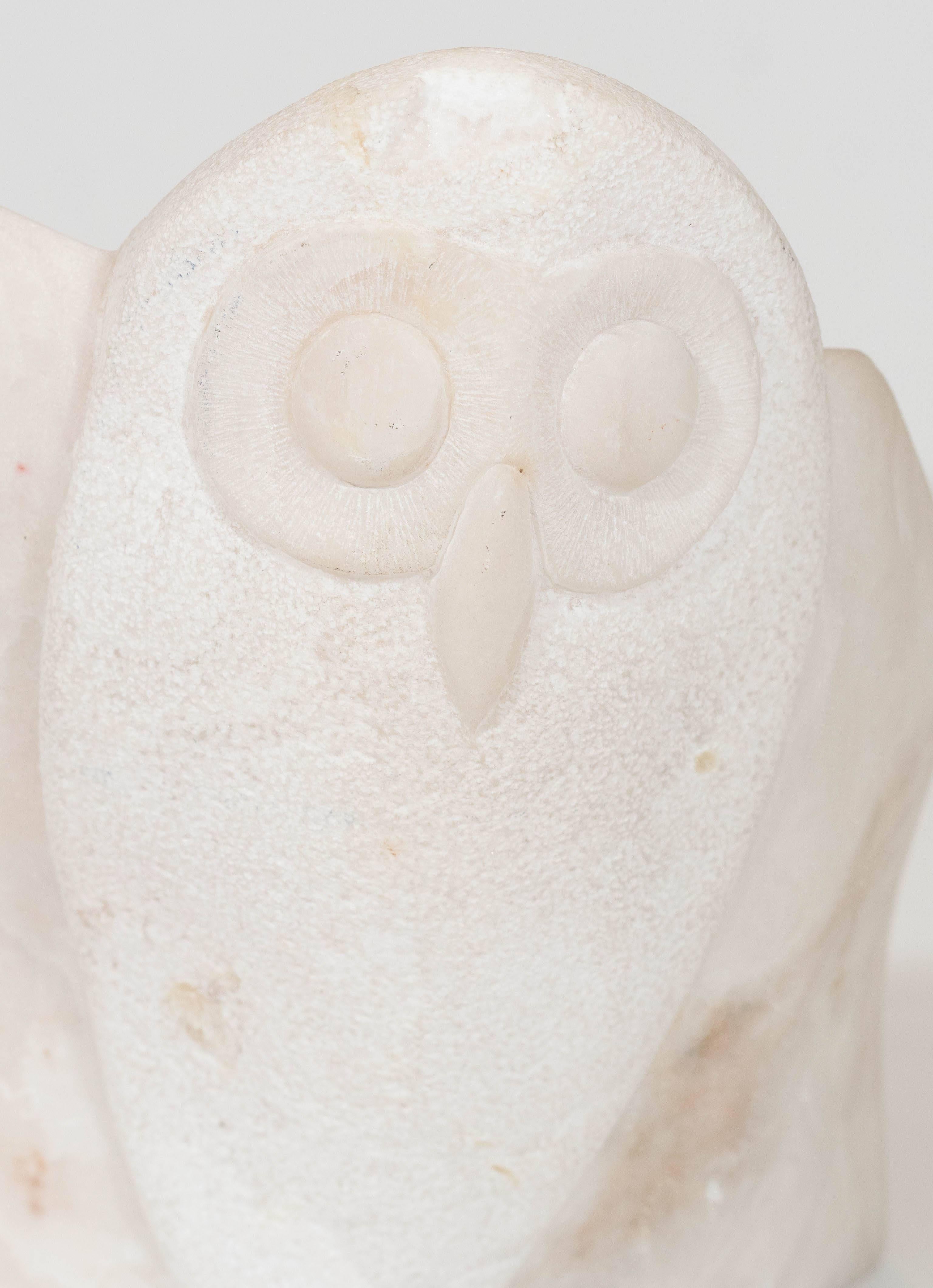 This modernist carved marble sculpture was produced by an unknown artist, circa 1980s, in the form of an owl preparing to take flight. Markings include artist's signature and date [Mena, 85], etched into the base of the piece. Very good condition,