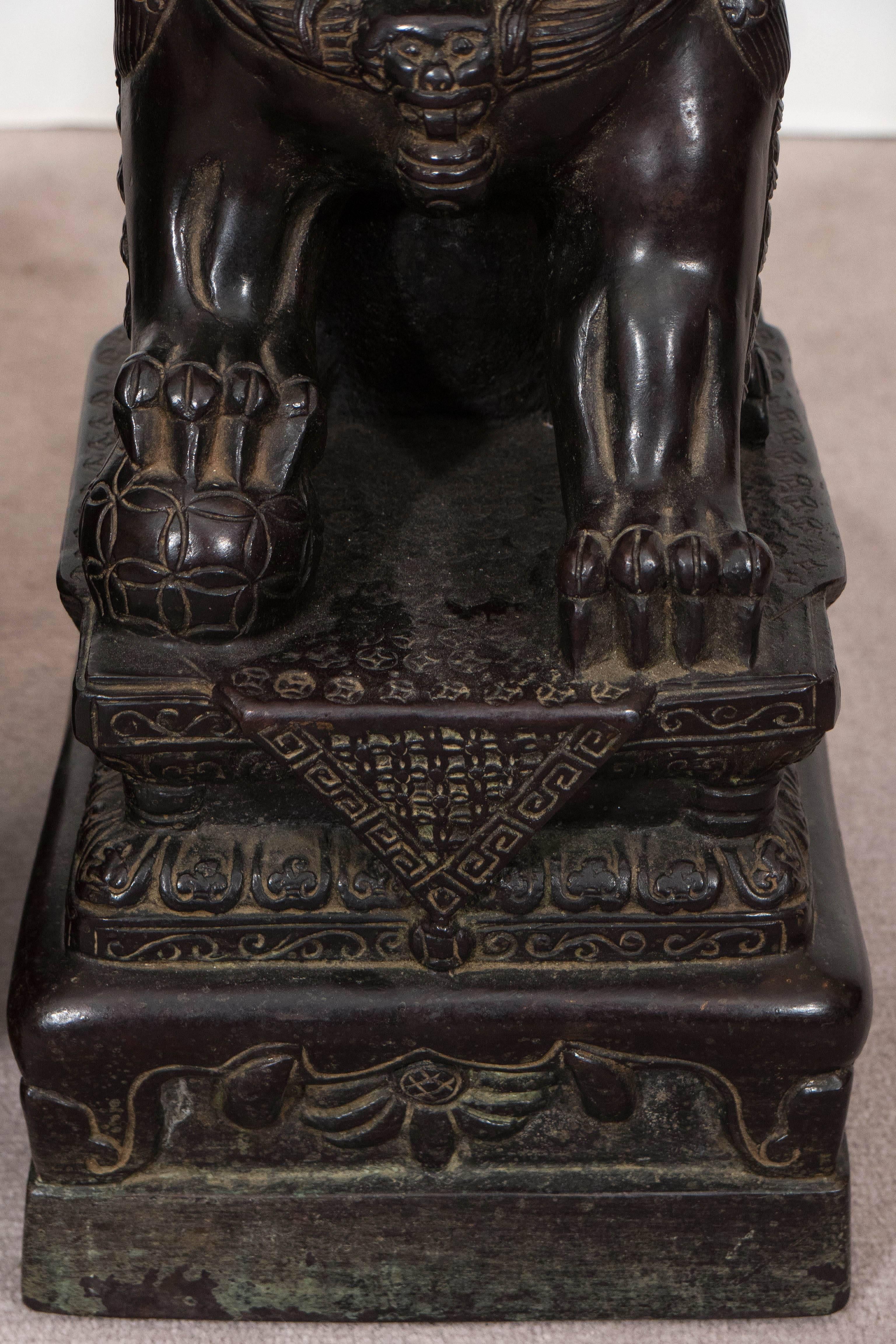 Pair of Chinese Foo Dogs on Pedestals in Bronze In Good Condition In New York, NY