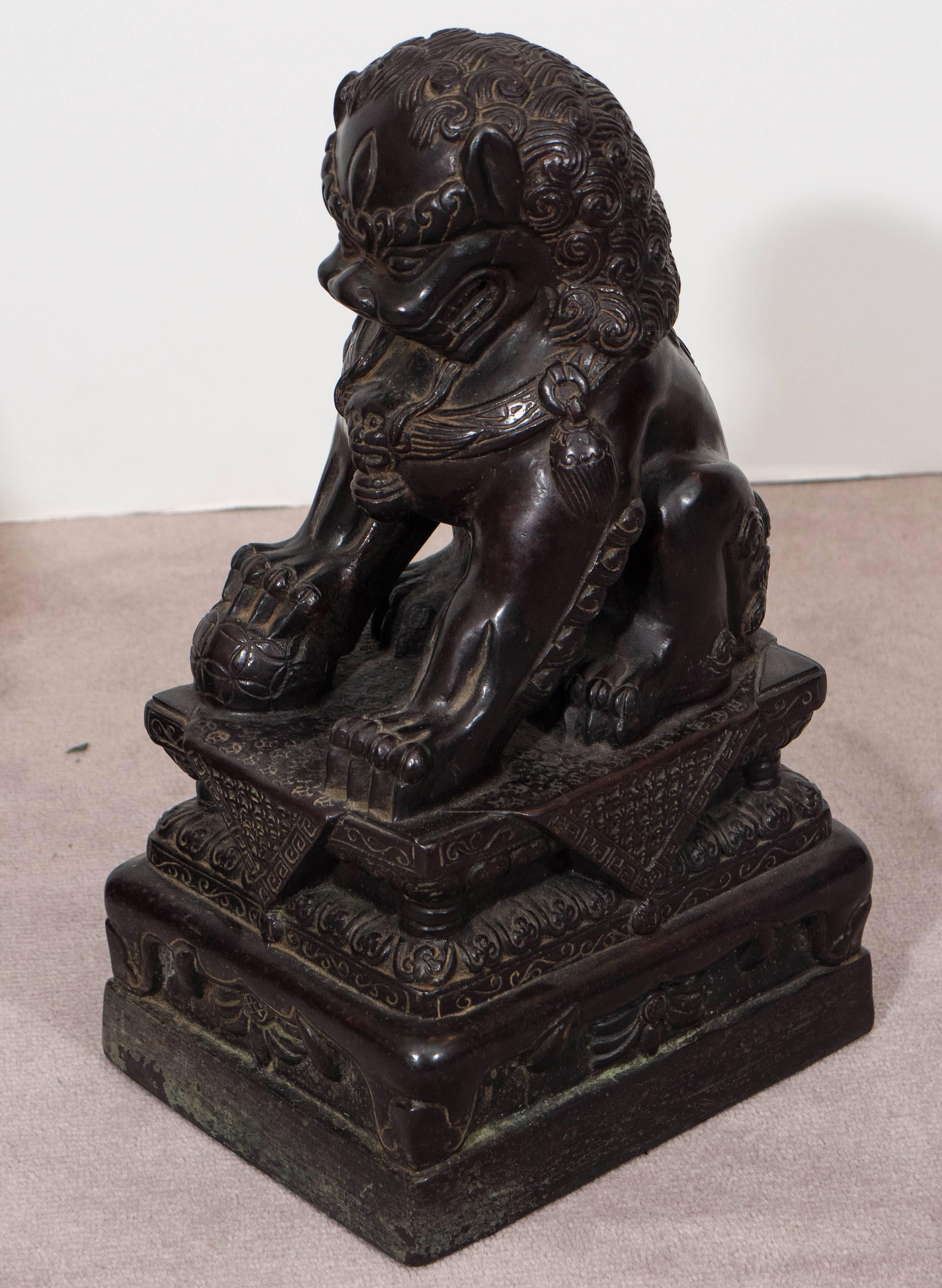 20th Century Pair of Chinese Foo Dogs on Pedestals in Bronze
