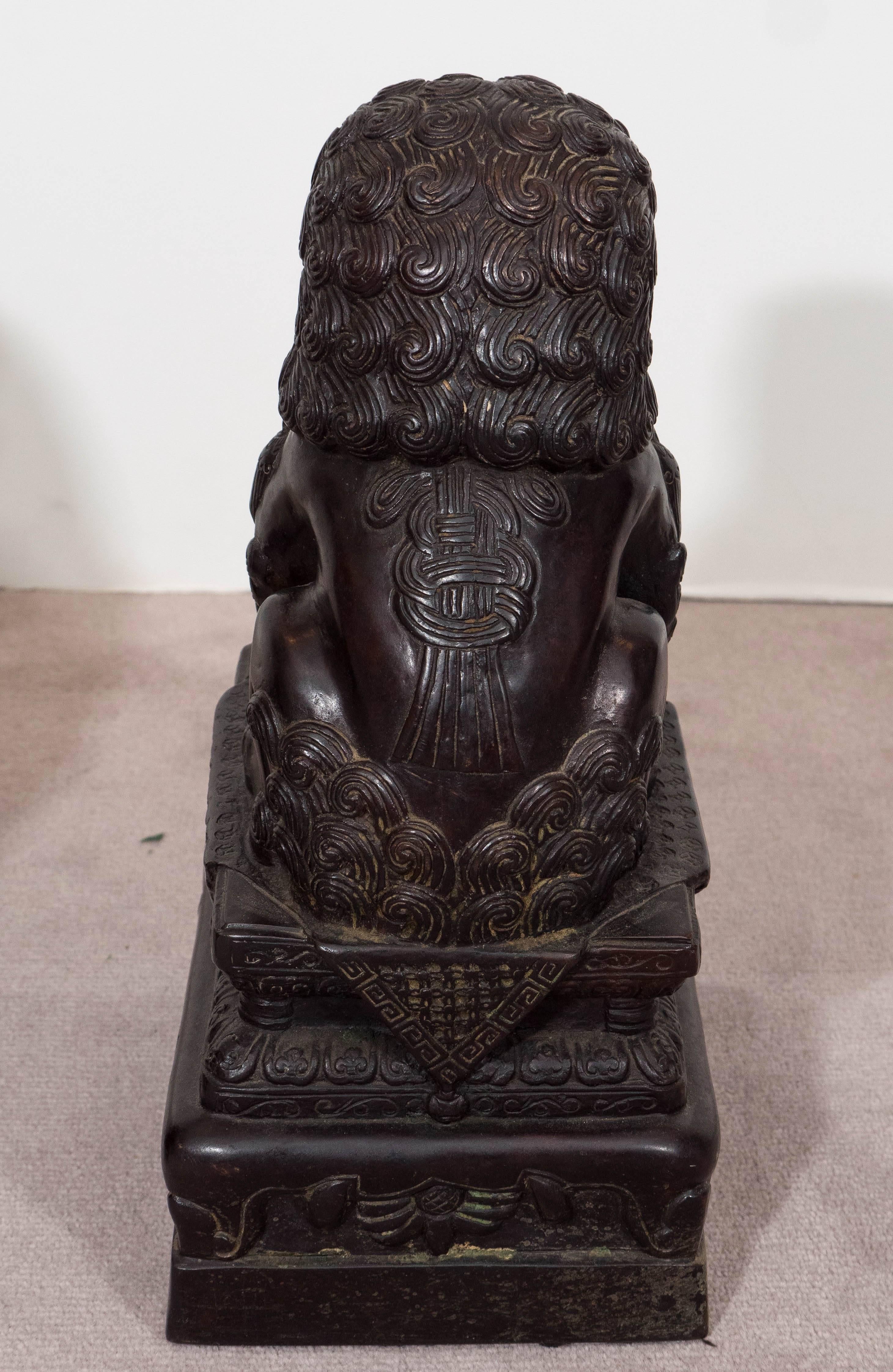 Pair of Chinese Foo Dogs on Pedestals in Bronze 3