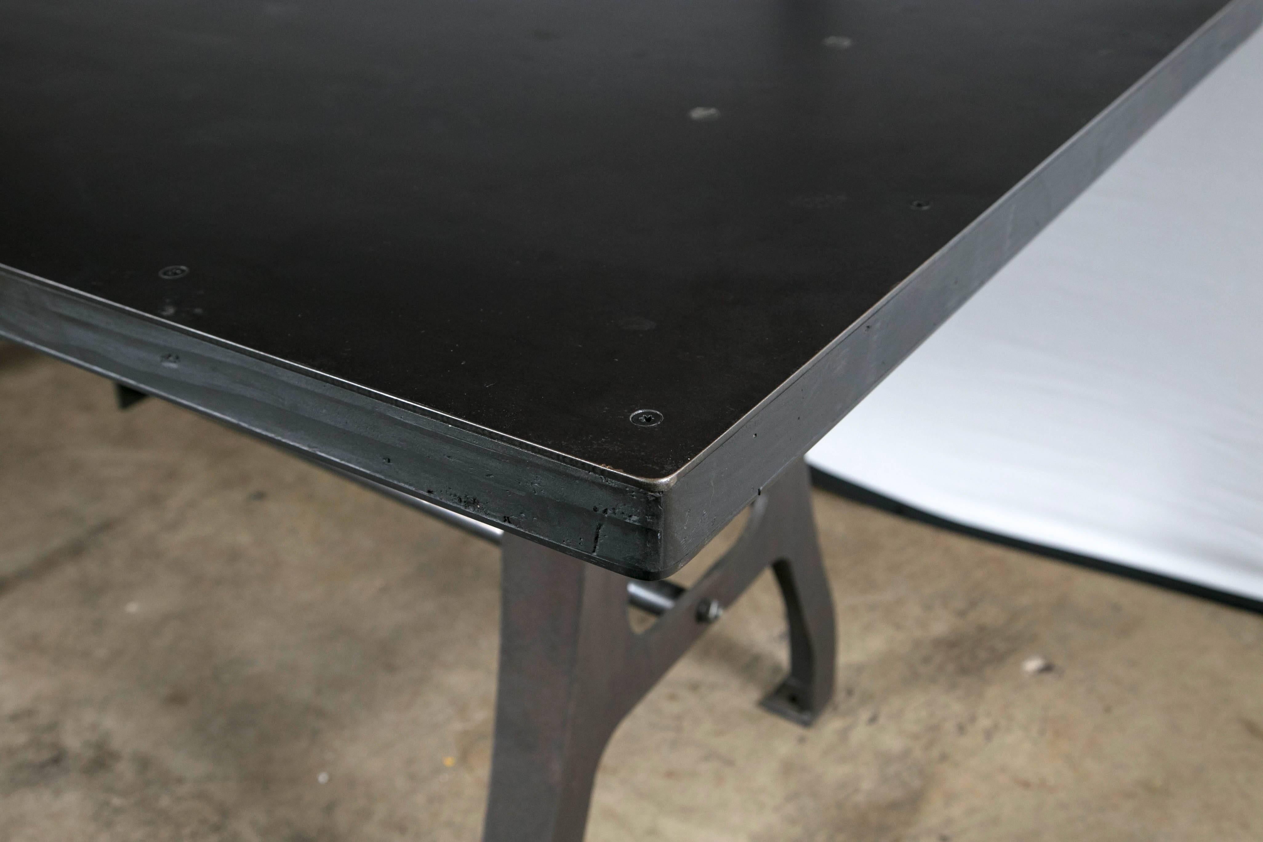 Vintage Industrial leg table with steel top.