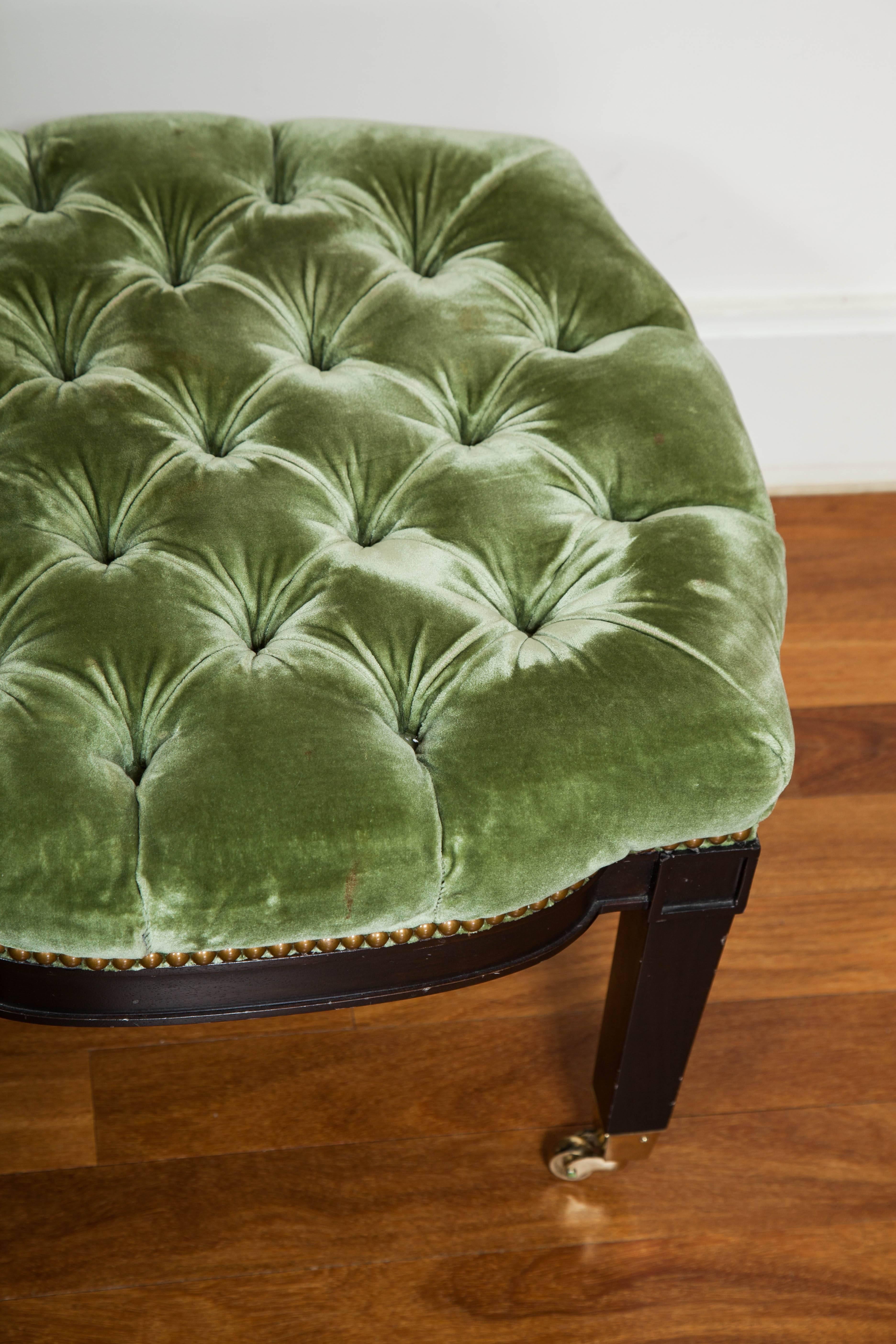Tufted ottoman on casters by Westwater Patterson, upholstered in Holly Hunt Bergamo Velluto. 