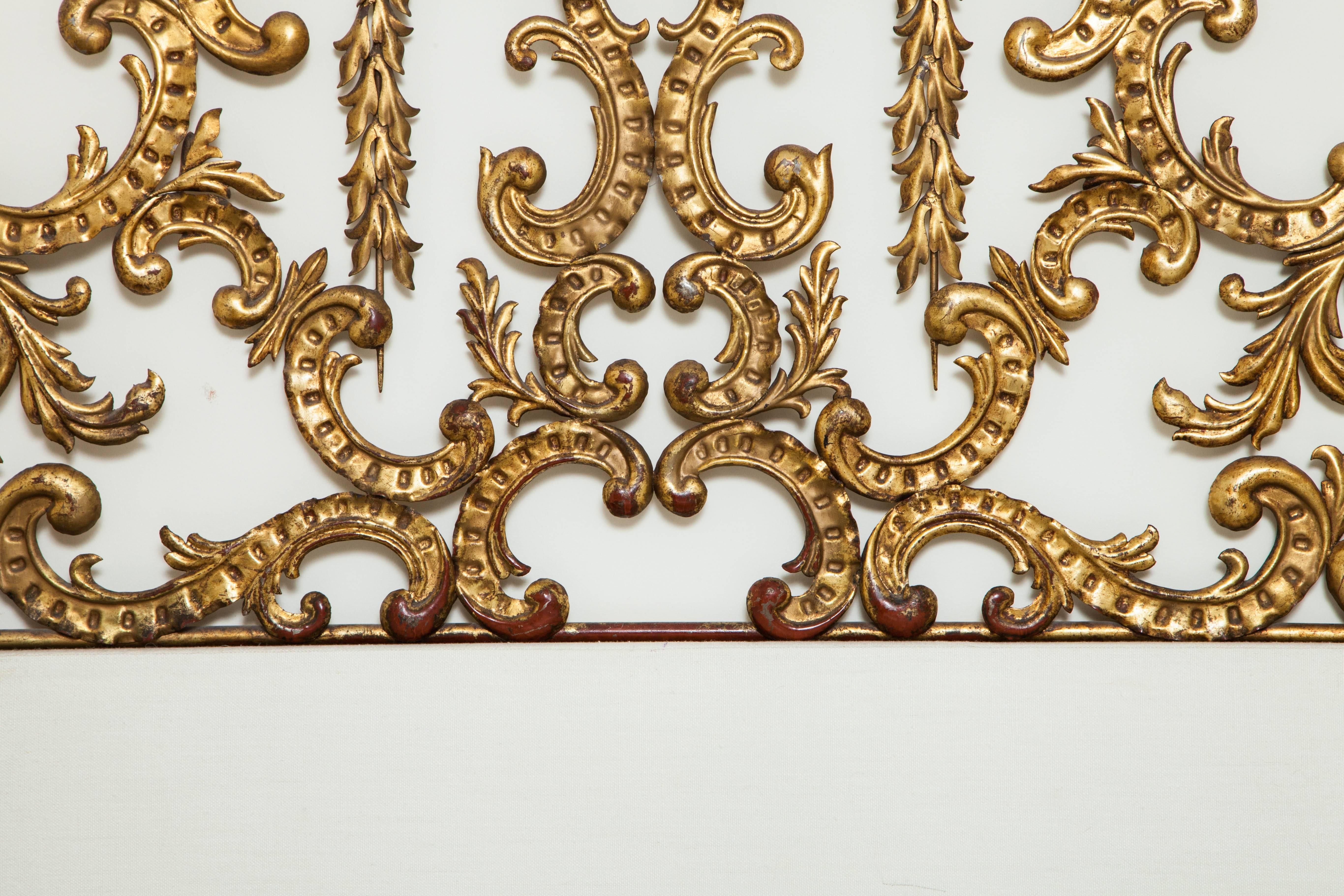 Ornate gilt king headboard, custom-made from a pair of antique twin bed frames. Mounts to the wall around a white fabric board (included).