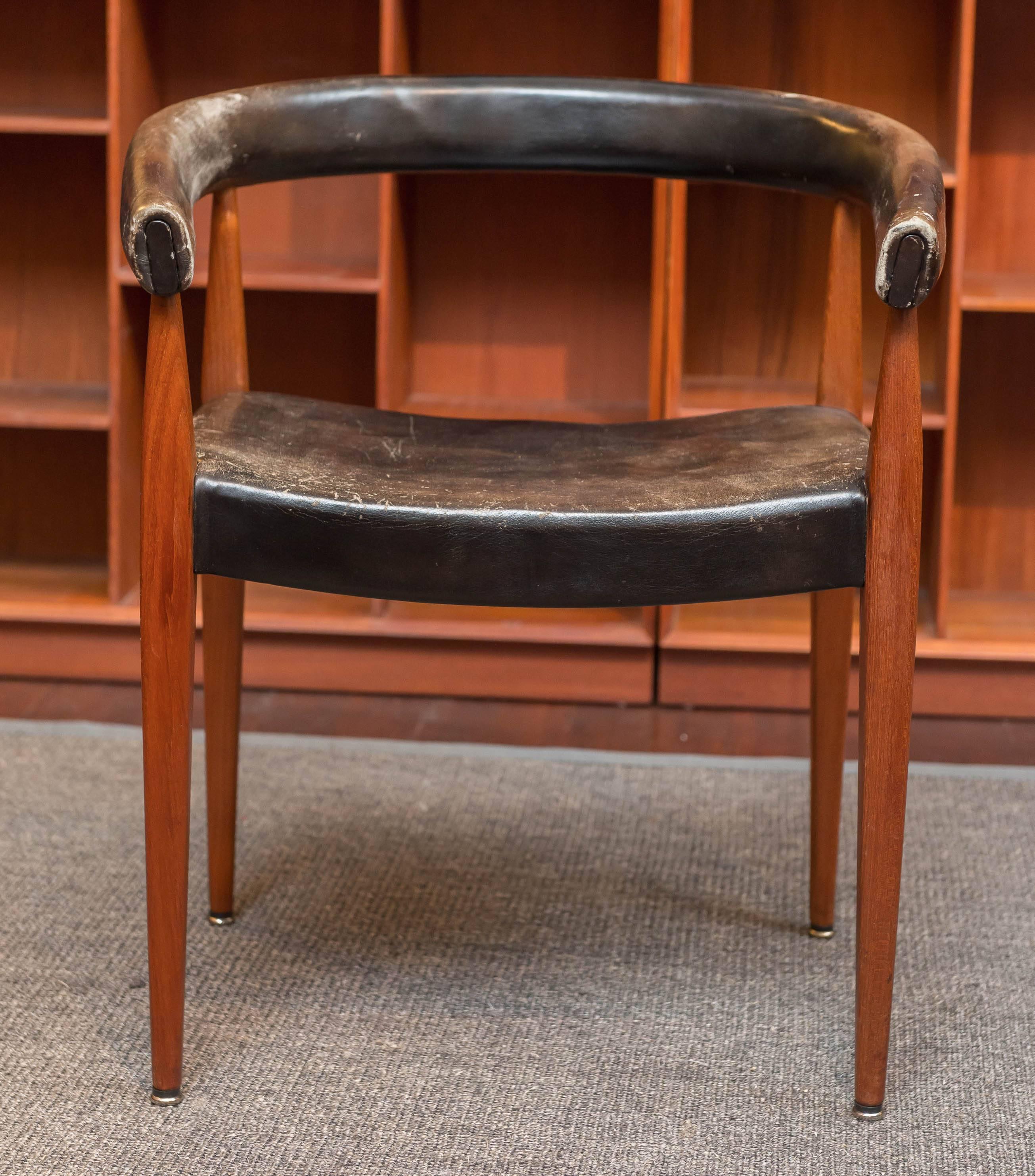 Rare and sculptural design armchair designed by Nanna Ditzel model #114 for Kolds Savvaerk, Denmark.
 The teak frames is in very good original condition, the black leatherette should be re- upholstered.