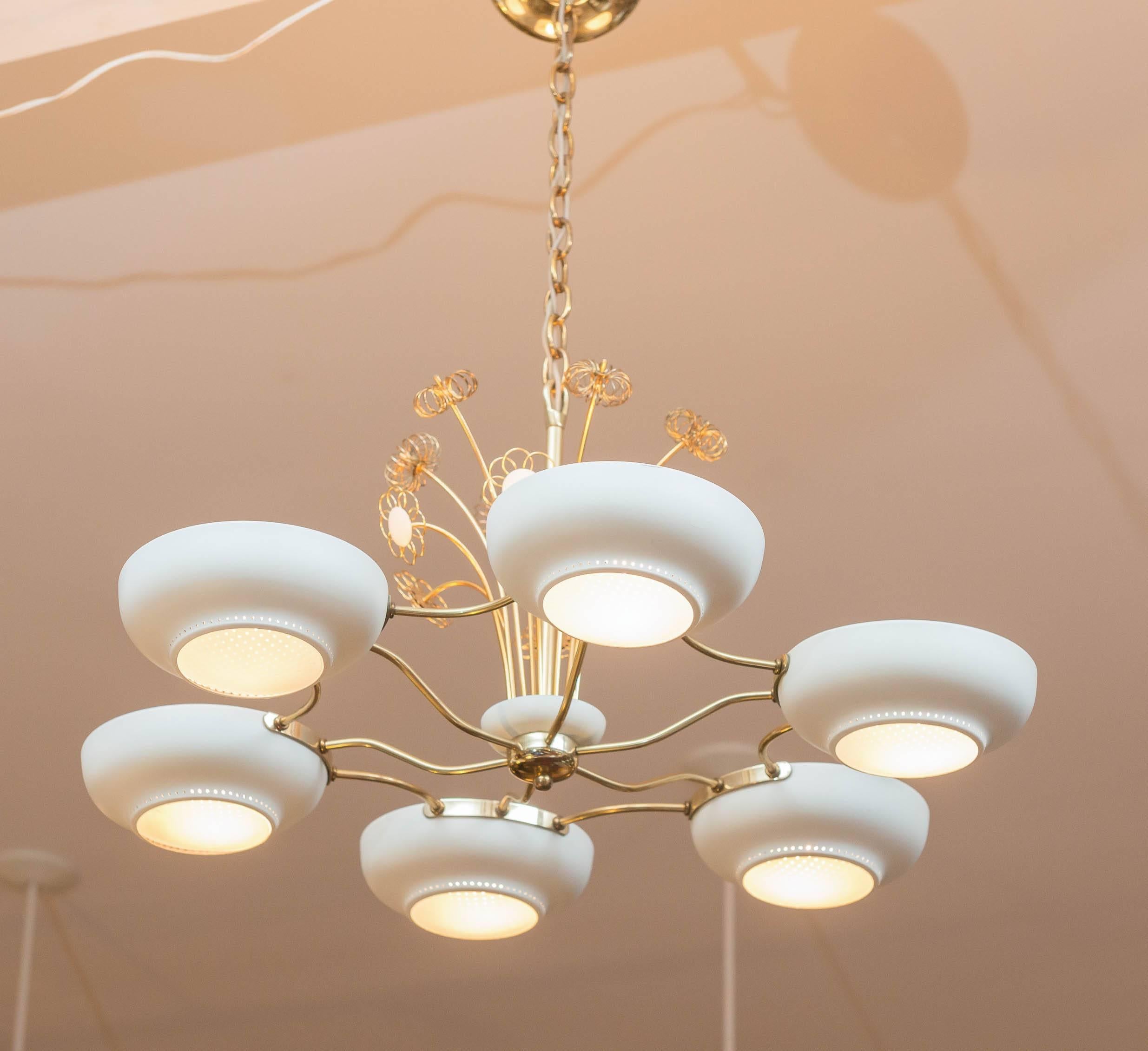 Paavo Tynell style six light chandelier with ivory white enamel shades and opaque glass diffusers. 
Playful brass daisy motif stems spring from the polished brass frame. Electrical in very good working order.