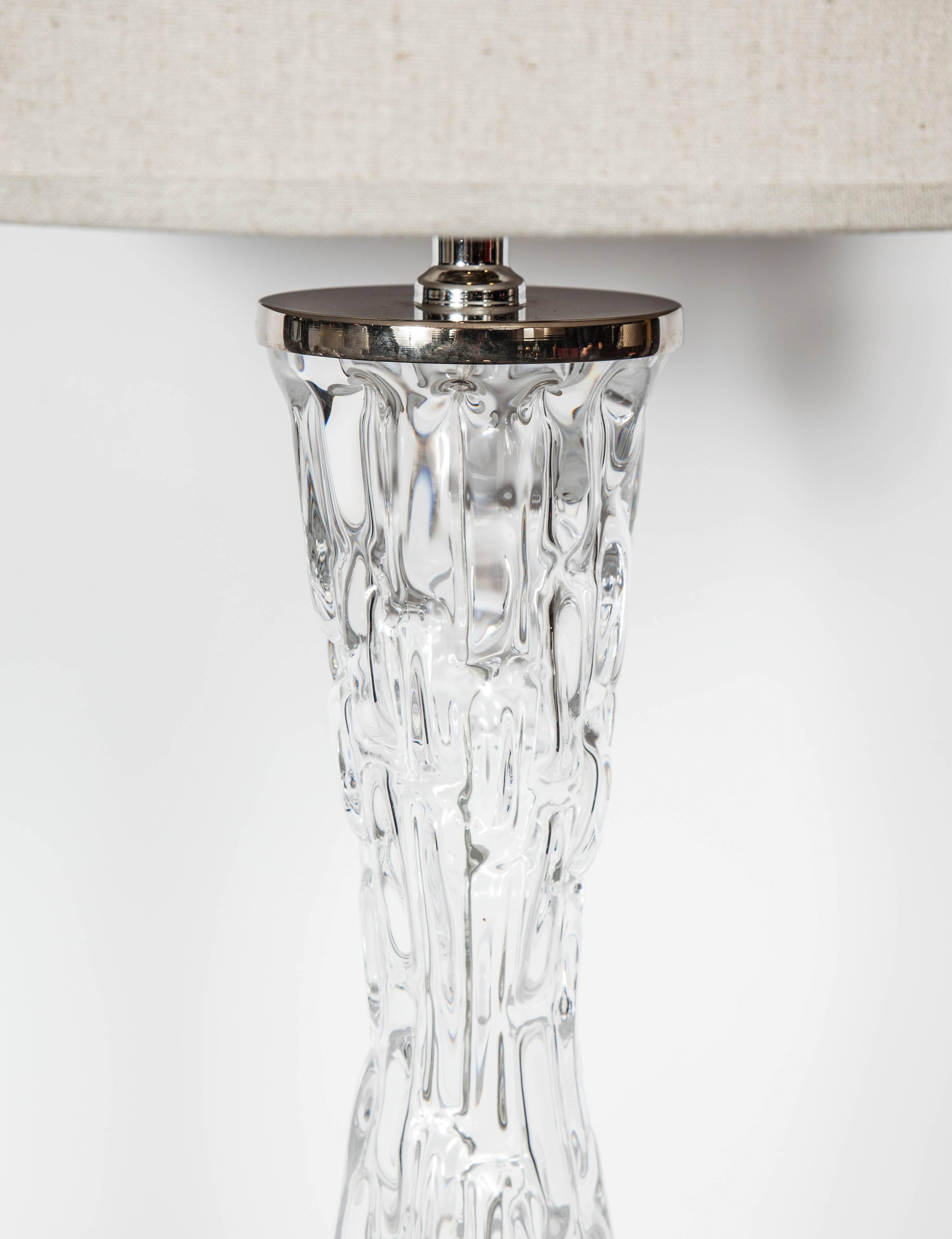 Gorgeous blown and molded glass lamp with highly stylized hourglass form. The lamp features faceted 