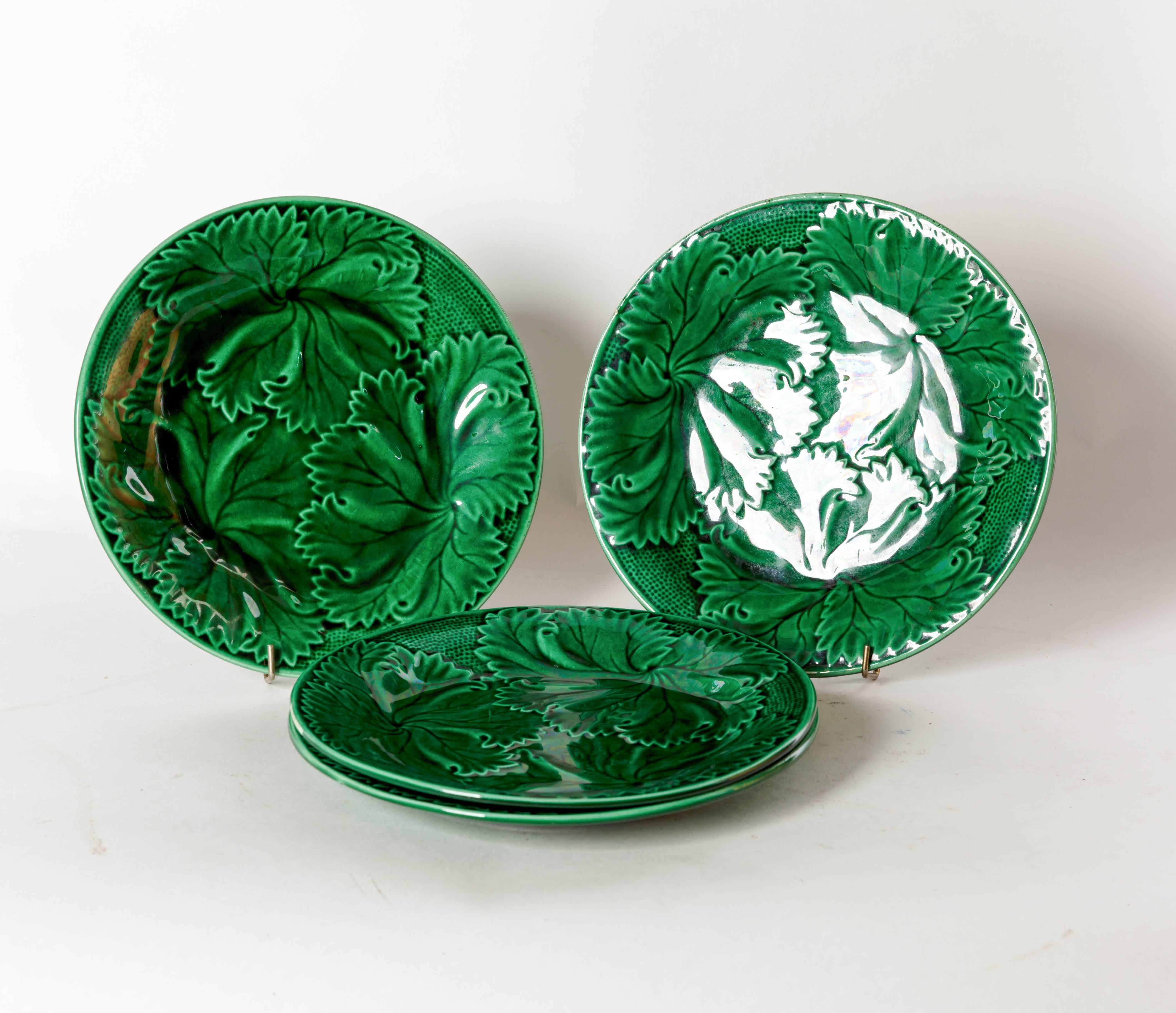 Four French green Majolica raised leaf pattern salad or dessert plates. The 
Back is impressed with a anchor, having the initials R & S. The mark stands for 
